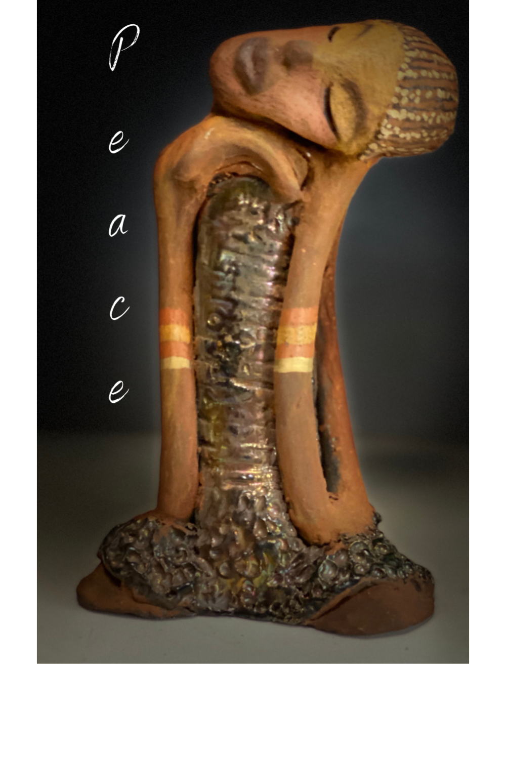 Meet Peace She got a makeover! Peace stands 9" x 5" x 4"and weighs 2.01 lbs. Peace has her tilted and resting on her shoulder. Her long loving arms are nested underneath her chin. Peace has a glossy textured metallic dress. Check out the makeover. She has a lovely two tone honey brown complexion . Peace wears braids and two tribal armbands. Peace is at peace and all is well.
