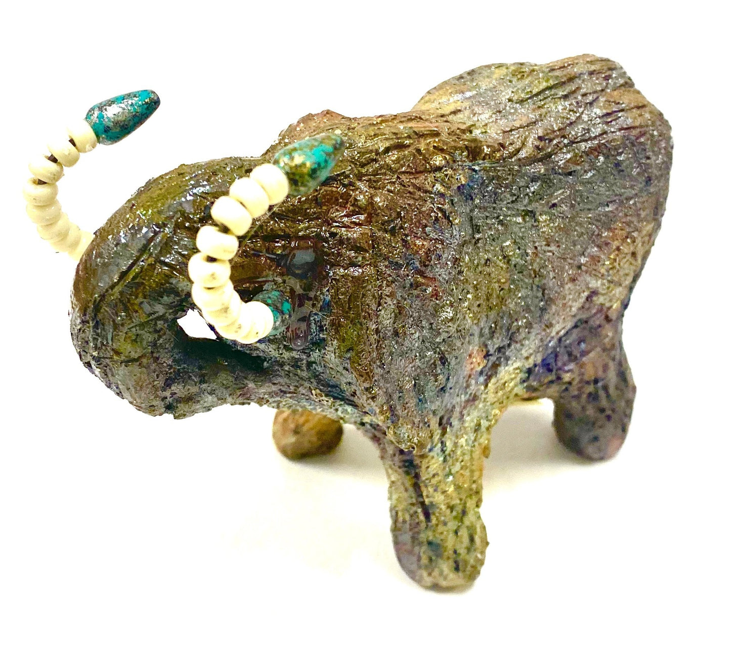 Have you HERD!!!!!! Elephants are one of my favorite animals to create. They are so majestic" Just one of these lovely Raku Fired Elephant will make an excellent gift for your BFF, or just for you . This raku fired elephant sits 4.5" x 3" x 4" and weighs 1 lbs. She has beaded tusks and a textured copper charcoal body. This one will be nice to add your Herdew Collection!