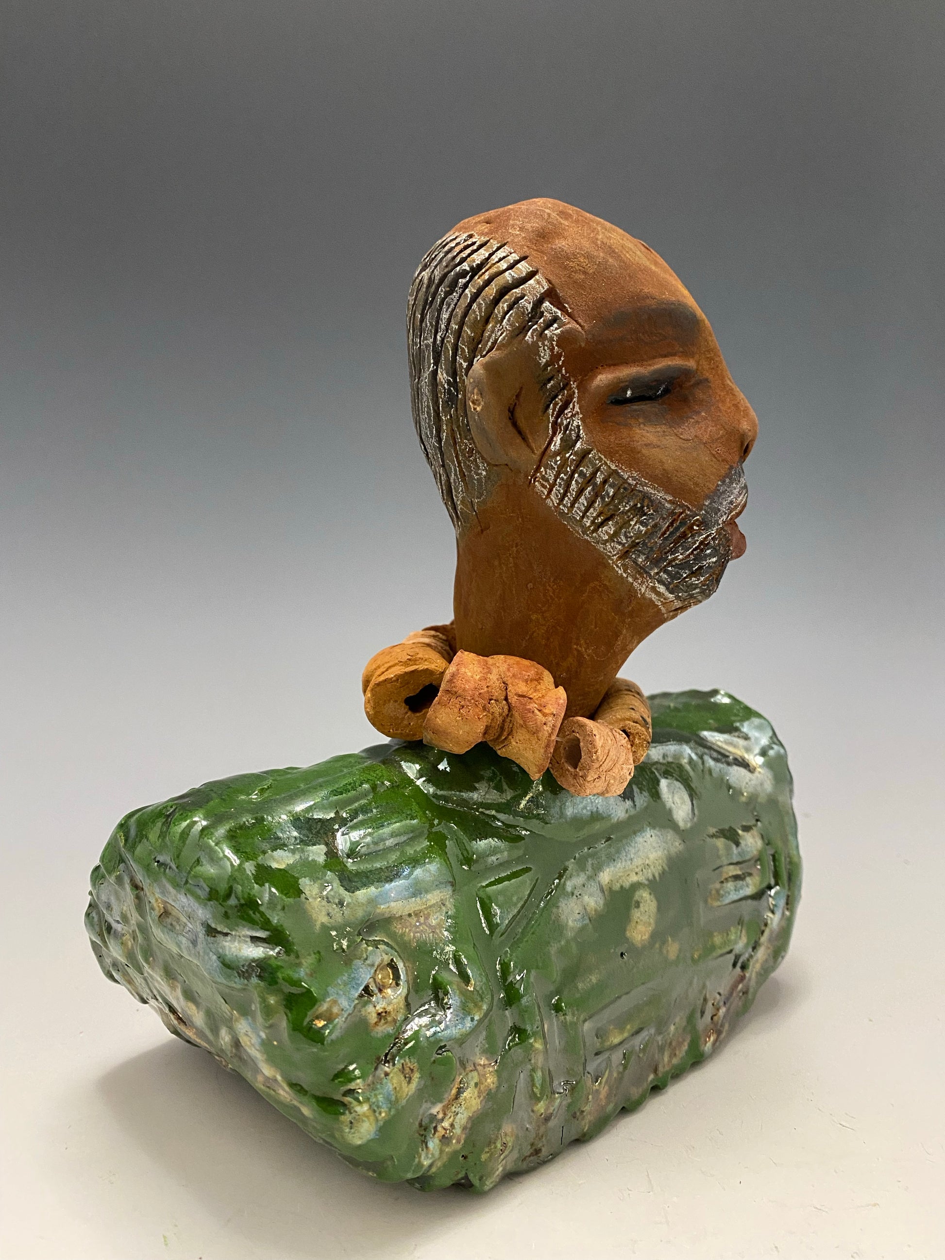 Learning to draw is really a matter of learning to see - to see correctly - and that means a good deal more than merely looking with the eye.- Lester Jones  Meet James! Albert stands 7.5" x 6" x 3" and weighs 2.5lbs. Albert wears a colorful metallic copper green dashiki. He is partially bald with a salt and peppered beard. Yes ,,,,,,He is one of few Men found in the Herdew collection!