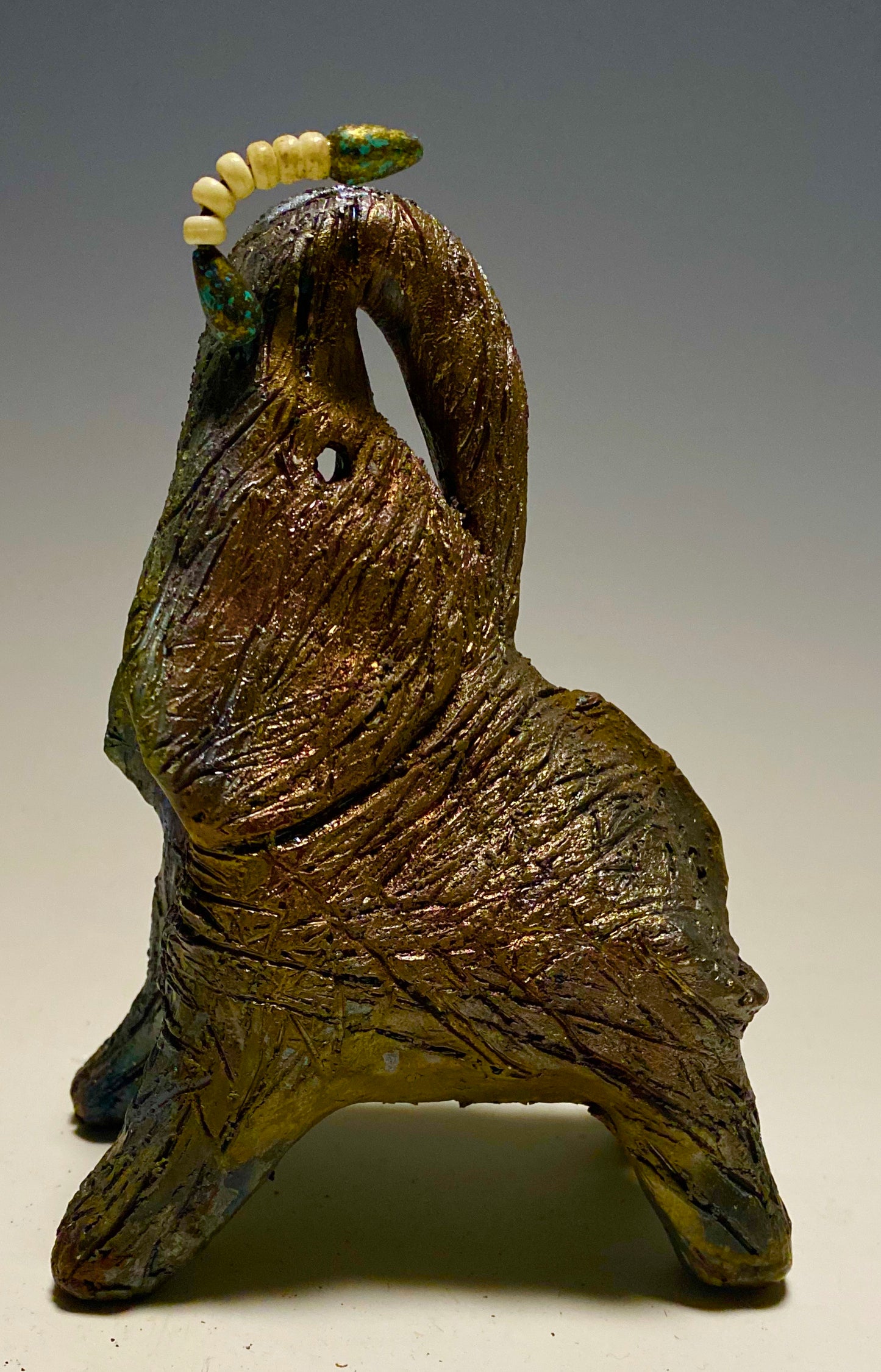 Have you HERD!!!!!! Elephants are one of my favorite animals to create. They are so majestic" Just one of these lovely Raku Fired Elephant will make an excellent gift for your BFF, or just for you . This raku fired elephant stands 6" x 3" x 4.5" and weighs 1 lb. She has beaded tusks and a textured charcoal and copper metallic body. This one will be nice to add your Herdew Collection!