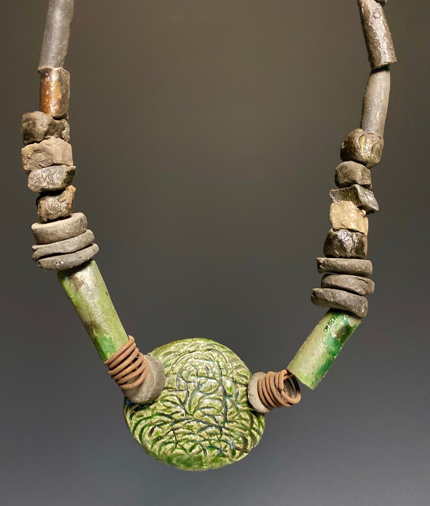 Nice!! Don't Let this one get away! Centerpiece large Raku bead (2) wire 1” coil 12' hang 25+ raku beads
