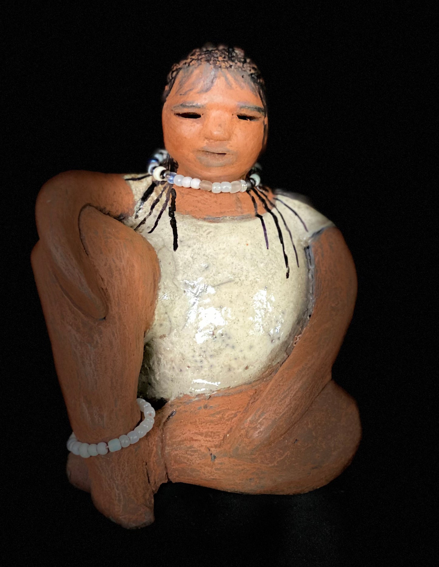 Meet Shelia ! You will fall in love with Shelia! Yes she is a big girl with lots of charm! Her long loving arms are relaxed atop her legs. Shelia has a lovely honey rust colored complexion. Shelia sits 6" x 5" x 4" and weighs 1.5 lbs. Shelia 's dress is a warm matte white crackle. Shelia’s hair is made of clay with many fine draw in braids. Check out our Shipping and Return policy Free Shipping! Got Questions???? Instant Message or Chat with me.