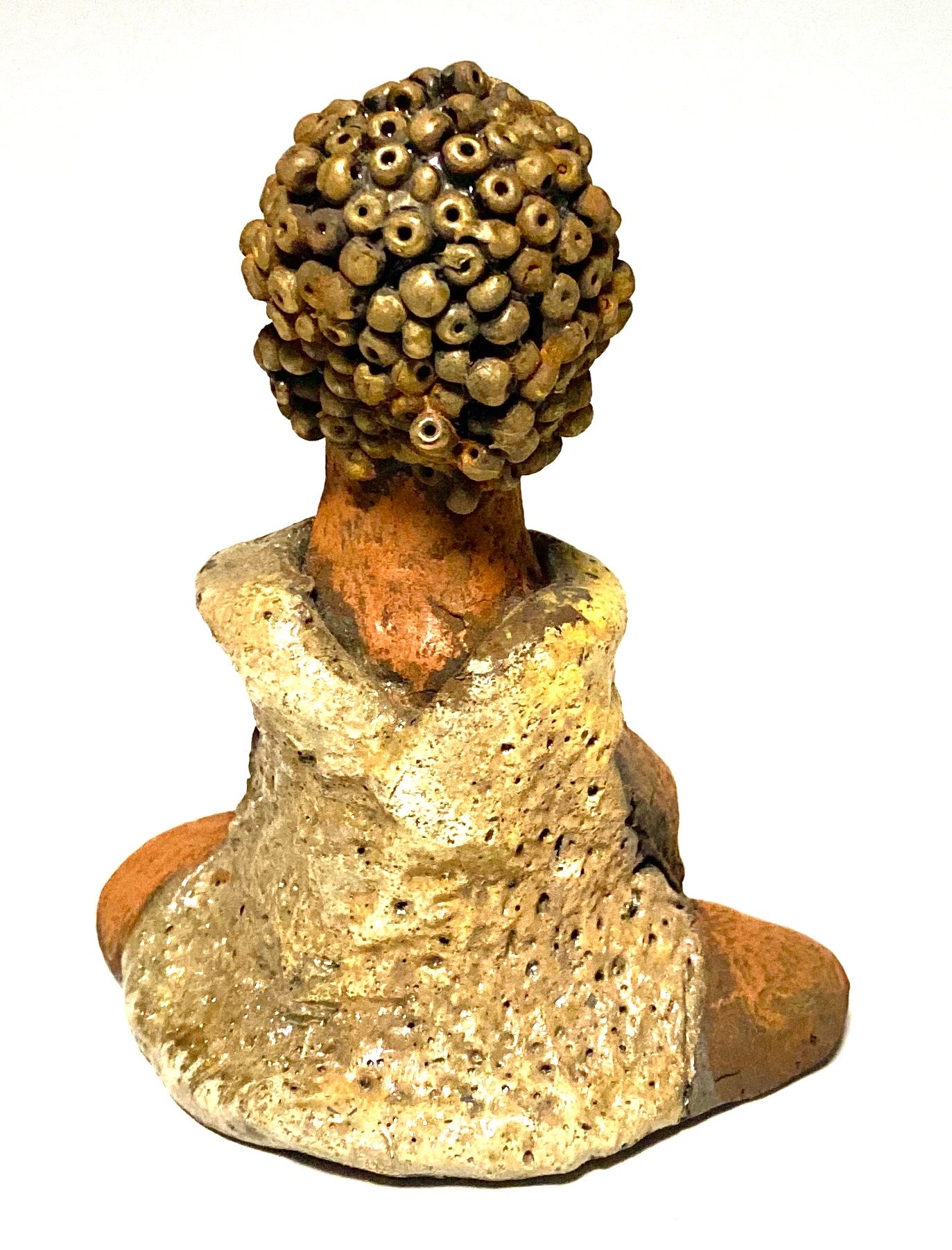 Meet Little Marissa! Marissa stands 4.5" x 4" x 2.5" and weighs 6.7 ozs. Marissa has a lovely glossy gold dress. She gold beaded hair. Marissa appears to sit in a yoga pose. Her long arms rest at her side. Marissa is a great starter piece from the Herdew Collection!
