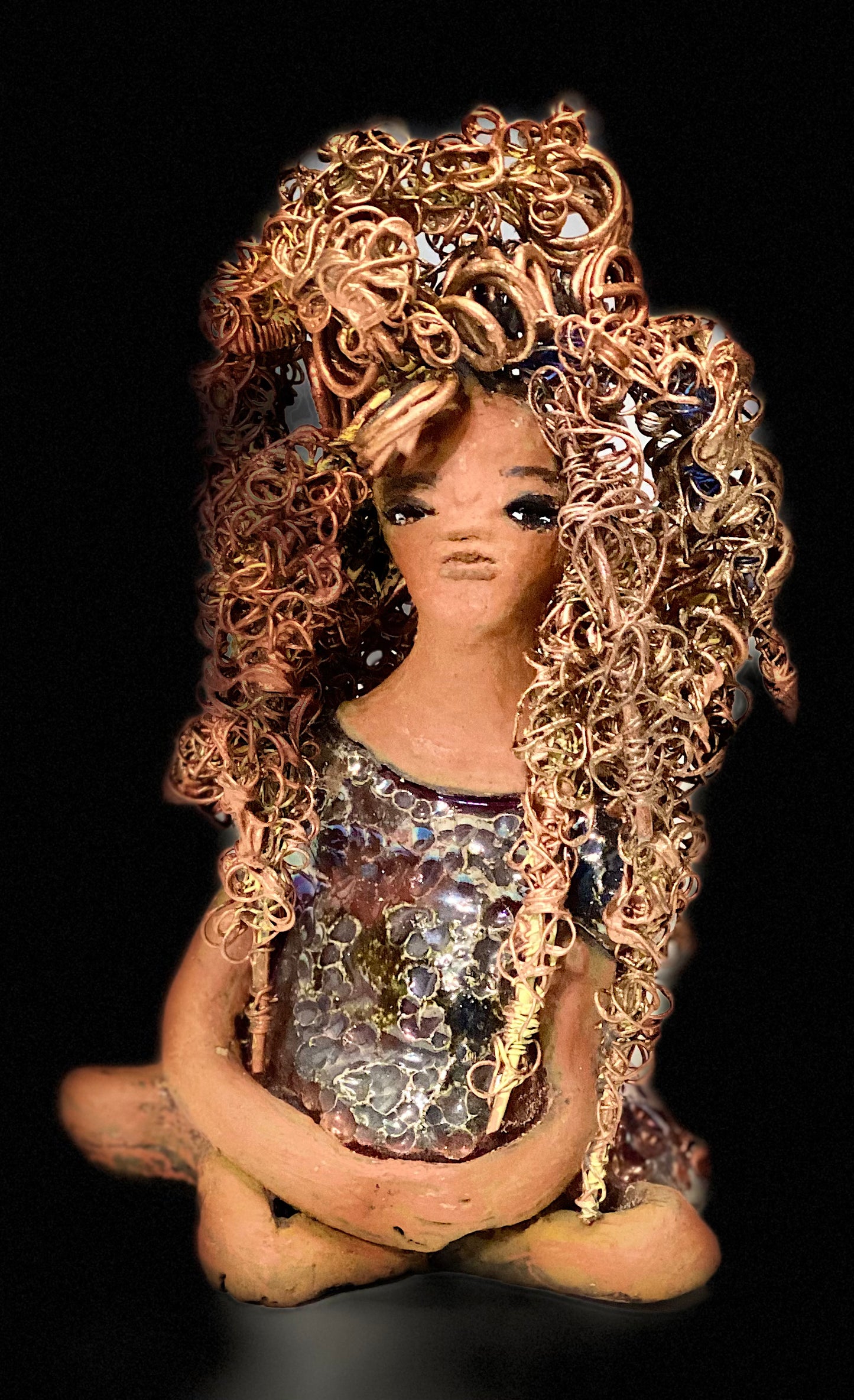 Meet Tiana! Tiana stands 5" x 3.5" x 3.5" and weighs 10 ozs. She has a lovely honey brown complexion. Tiana's dress is metallic copper. She has her long loving arms resting at her side. " I am really pleased with Tiana's blue beaded necklace and her new wire hair Find a place in your space for Tiana!