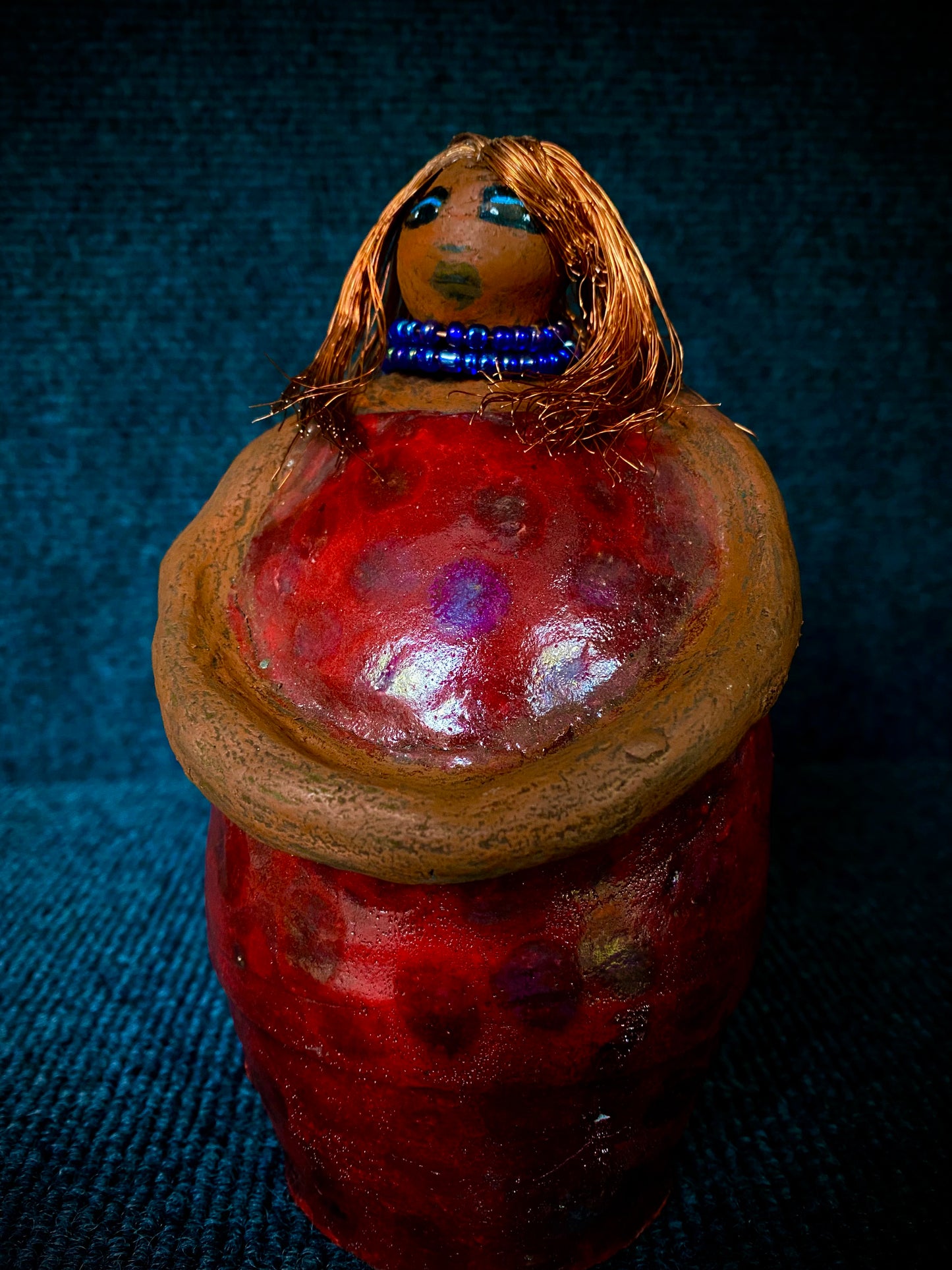 Meet Dora! She is a big girl who loves to sing and has aspirations of becoming a movie star. Dora stands 7" x 4" x 4.5" and weighs 1.06 lbs. She has a lovely honey brown complexion with lovely reddish brown lips. Dora has a lovely gold spotted heart glazed dress. She wears a beaded dark blue necklace. With eyes wide opened, Dora has hopes of finding a new home. Dora has a twin sister name Cora.