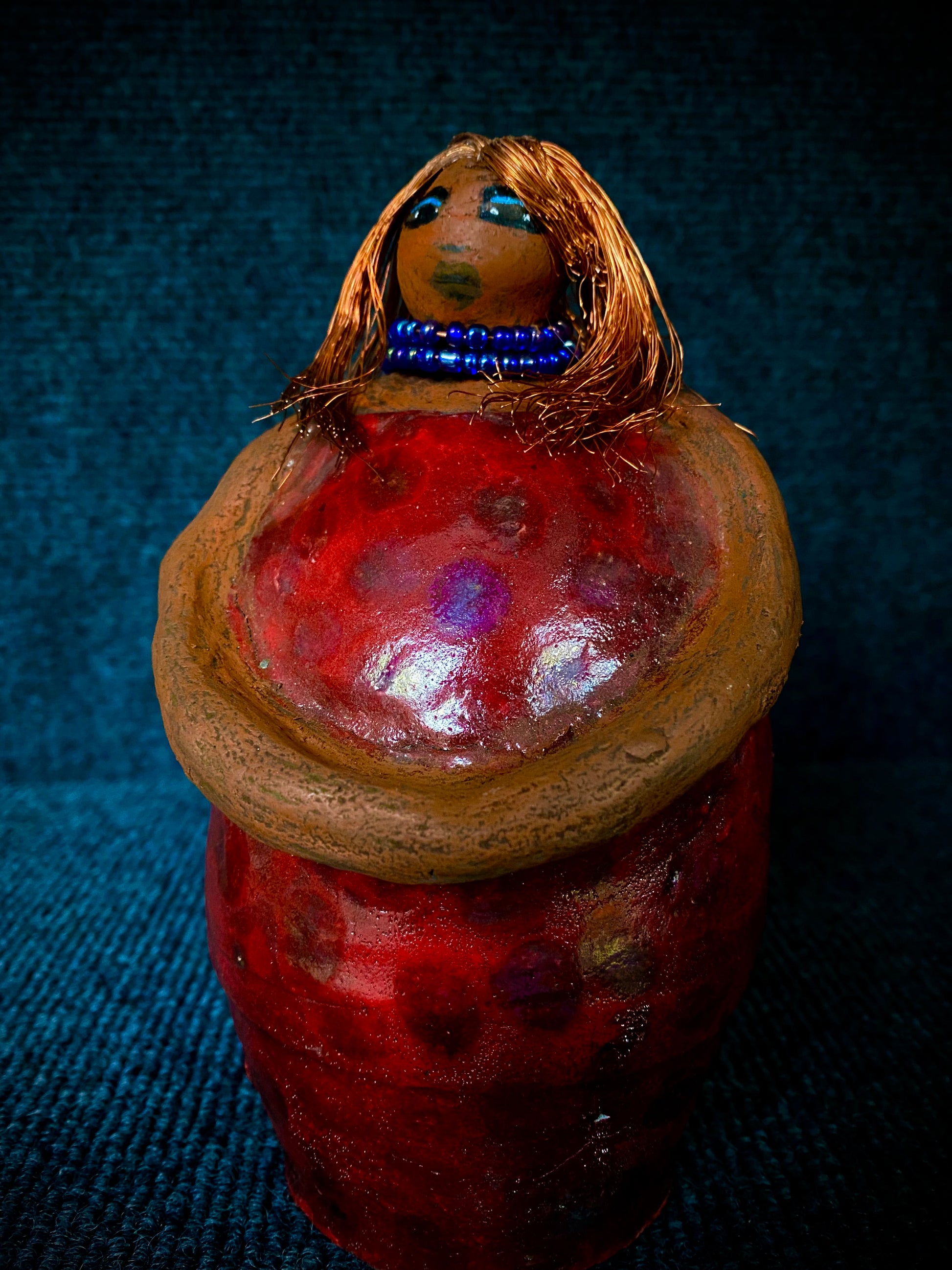 Meet Dora!  She is a big girl who loves to sing and has aspirations of becoming a  movie star.  Dora stands 7" x 4" x 4.5" and weighs  1.06 lbs.  She has a lovely honey brown complexion with lovely reddish brown lips.  Dora has a lovely gold spotted heart glazed dress.  She wears a beaded  dark blue necklace.  With eyes wide opened, Dora has hopes of finding a new home.   Dora has a twin sister name Cora.