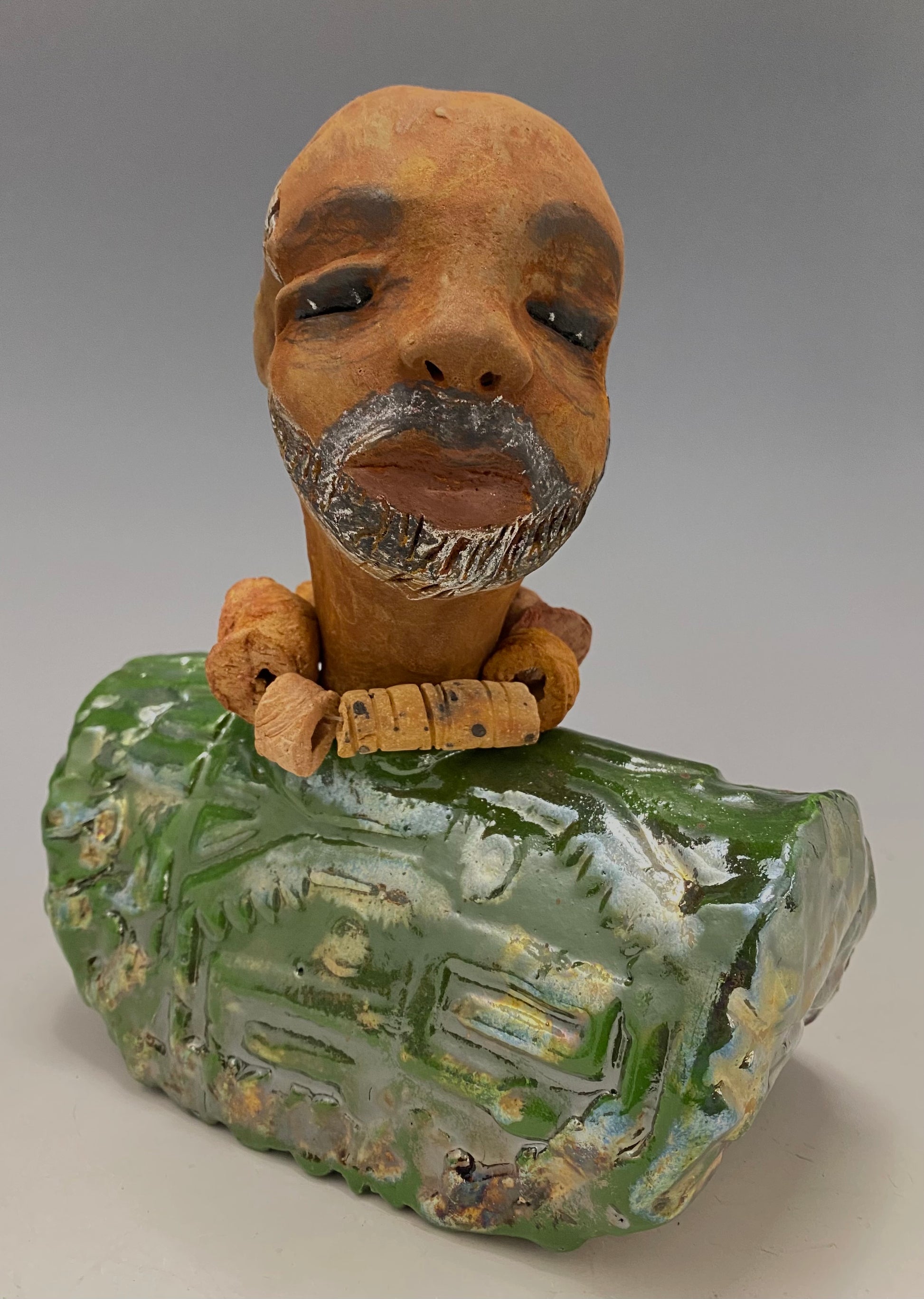 Learning to draw is really a matter of learning to see - to see correctly - and that means a good deal more than merely looking with the eye.- Lester Jones  Meet James! Albert stands 7.5" x 6" x 3" and weighs 2.5lbs. Albert wears a colorful metallic copper green dashiki. He is partially bald with a salt and peppered beard. Yes ,,,,,,He is one of few Men found in the Herdew collection!