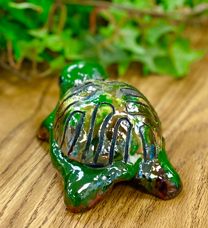 Boys, girls, men, and women of all ages talked about how cute they are. They got a kick out of and adored the turtles that were named after someone they knew". Tommie is 2" x 2" x 4" and weighs 5.8 ozs. Tommie has a glossy green and copper complexion. Tommie is ready to Go!!