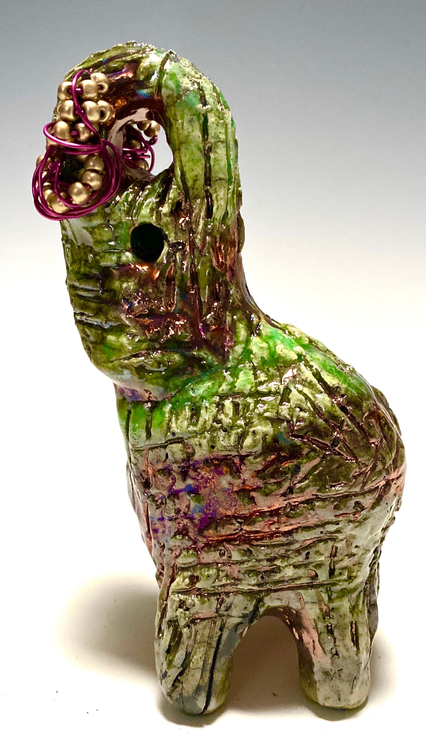 Raku Elephant Have you HERD!!!!!! Just one of these lovely Raku Fired Elephant will make an excellent gift for your friend, sorority or for your home’ special place centerpiece. 6" x 3" x 3" 1 lbs Beautiful smokey black baby raku elephant For decorative purposely only