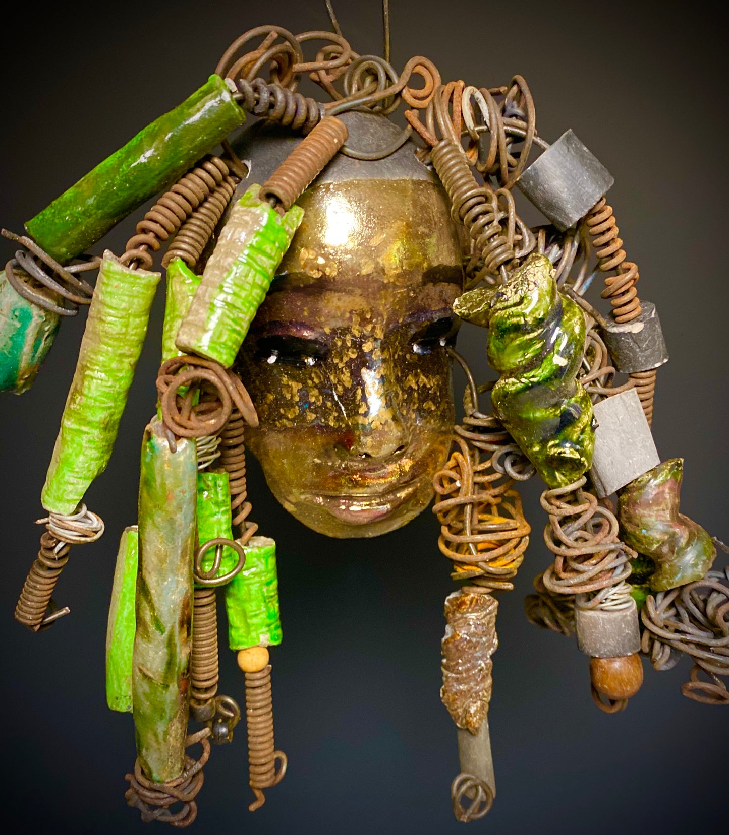 I started making art soon after seeing authentic African artwork at the Smithsonian Museum of African Art. I was in total awe. Jocelyn was inspired by my visit there. Jocelyn has a light and dark honey brown complexion. Her hair can be adjusted up to 11" x 10" and weighs 1.09 lbs Jocelyn has over 20 handmade multicolored raku fired beads. She has over 20 feet of coiled 16 gauge wire hair. Jocelyn is ready for display!