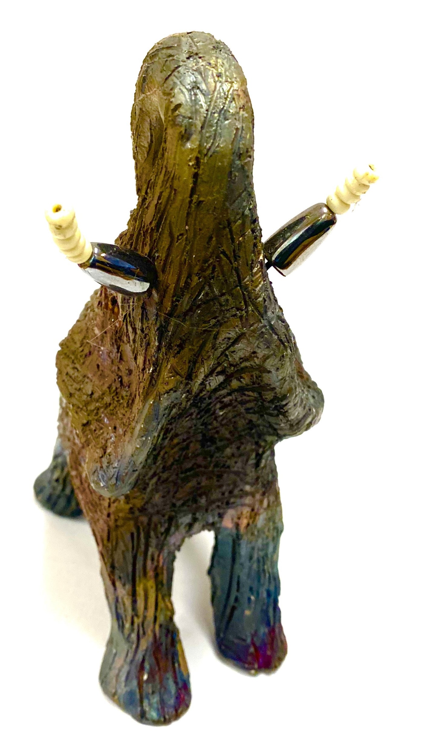 Raku Elephant Have you HERD!!!!!! Just one of these lovely Raku Fired Elephant will make an excellent gift for your friend, sorority or for your home’ special place centerpiece. 8" x 3" x 4" 1 lbs Beautiful metallic raku elephant white and silver beaded tusks For decorative purposely only.