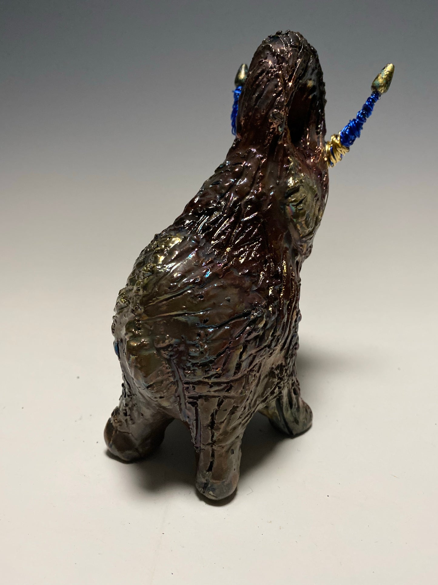 Raku Elephant Have you HERD!!!!!! Just one of these lovely Raku Fired Elephant will make an excellent gift for your friend, sorority or for your home’ special place centerpiece. 6" x 4" x 4" 1 lbs Beaded tusk with blue and gold wire Beautiful colorful metallic raku elephant For decorative purposely only