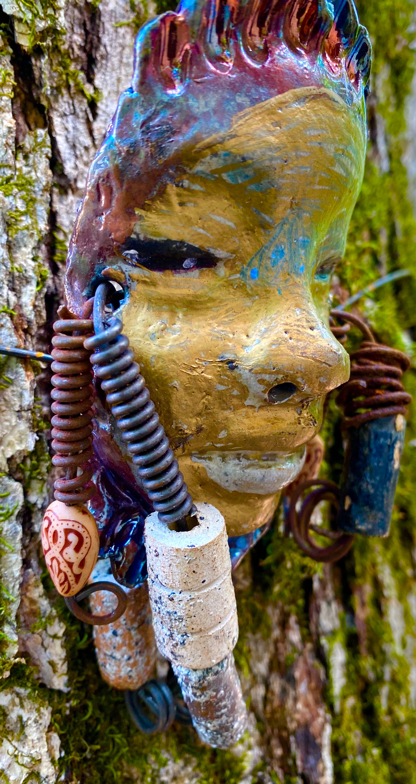 Meet Hope! I started making art soon after seeing authentic African artwork at the Smithsonian Museum of African Art. I was in total awe. Jafari was inspired by my visit there. Hope has a complexion of honey mustard and dark metallic copper. She is 6" x 4" and weighs 5 ozs. Hope has 2 tribal beads. Hope has over 4 feet of coiled 16 gauge wire hair.