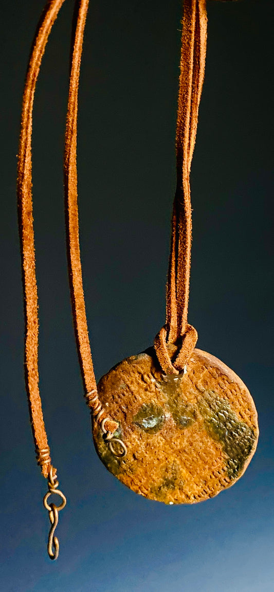 Earthy! 16"  brown suede cord. 1  earthy colored Raku disc Tribal!