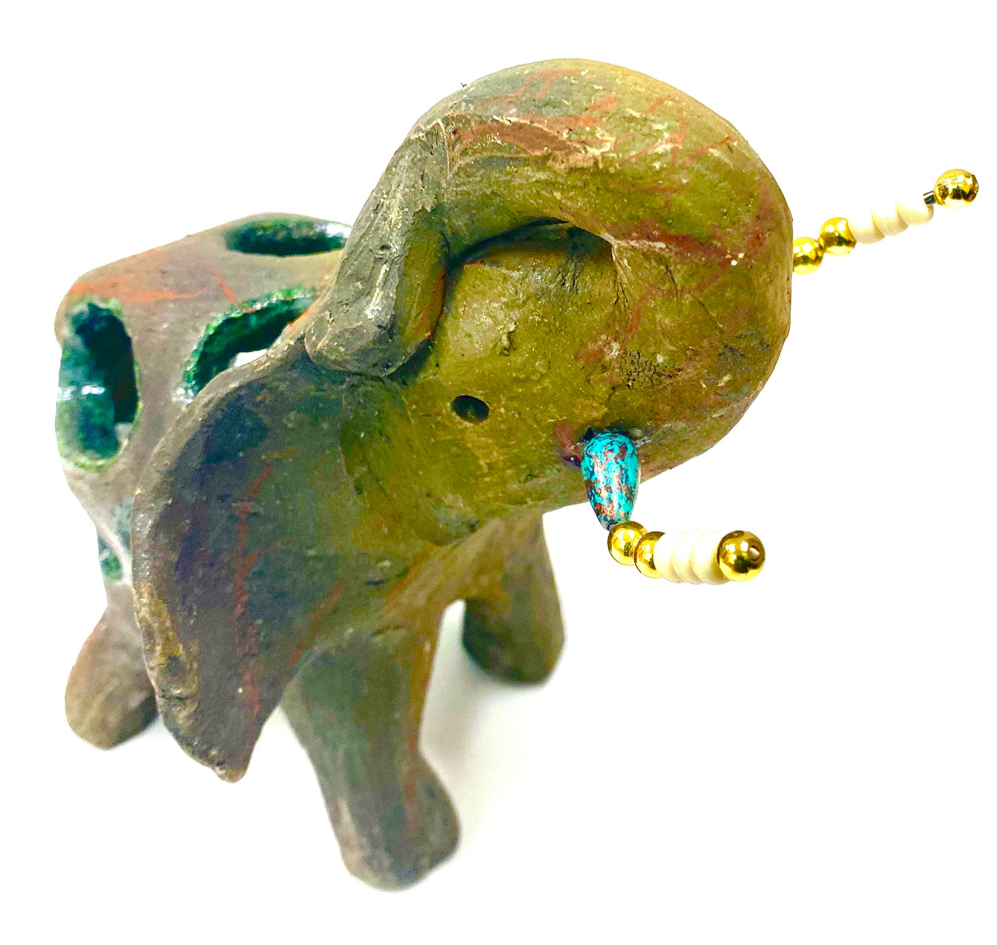 Raku Elephant Have you HERD!!!!!! Just one of these lovely Raku Fired Elephant will make an excellent gift for your friend, sorority or for your home’ special place centerpiece. 6" x 3" x 6" 1.4 lbs Beautiful metallic raku elephant with open body spaces. For decorative purposely only