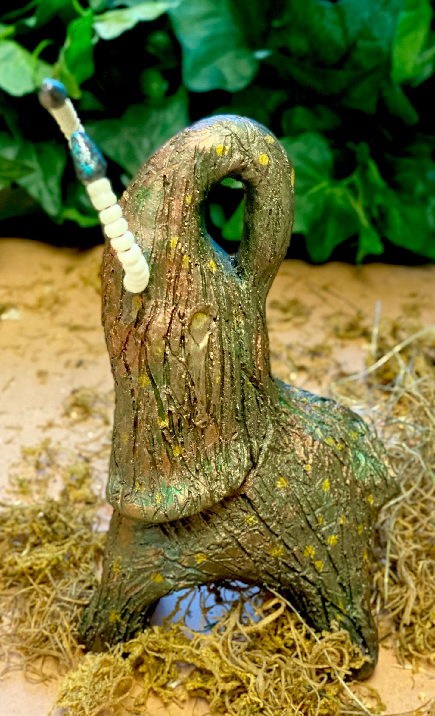 Just one of these lovely Raku Fired Elephant will make an excellent gift for your friend, sorority or for your home’ special place centerpiece. 7" x 3" x 4" 1 lbs Beautiful metallic raku elephant Beaded tusks For decorative purposely only