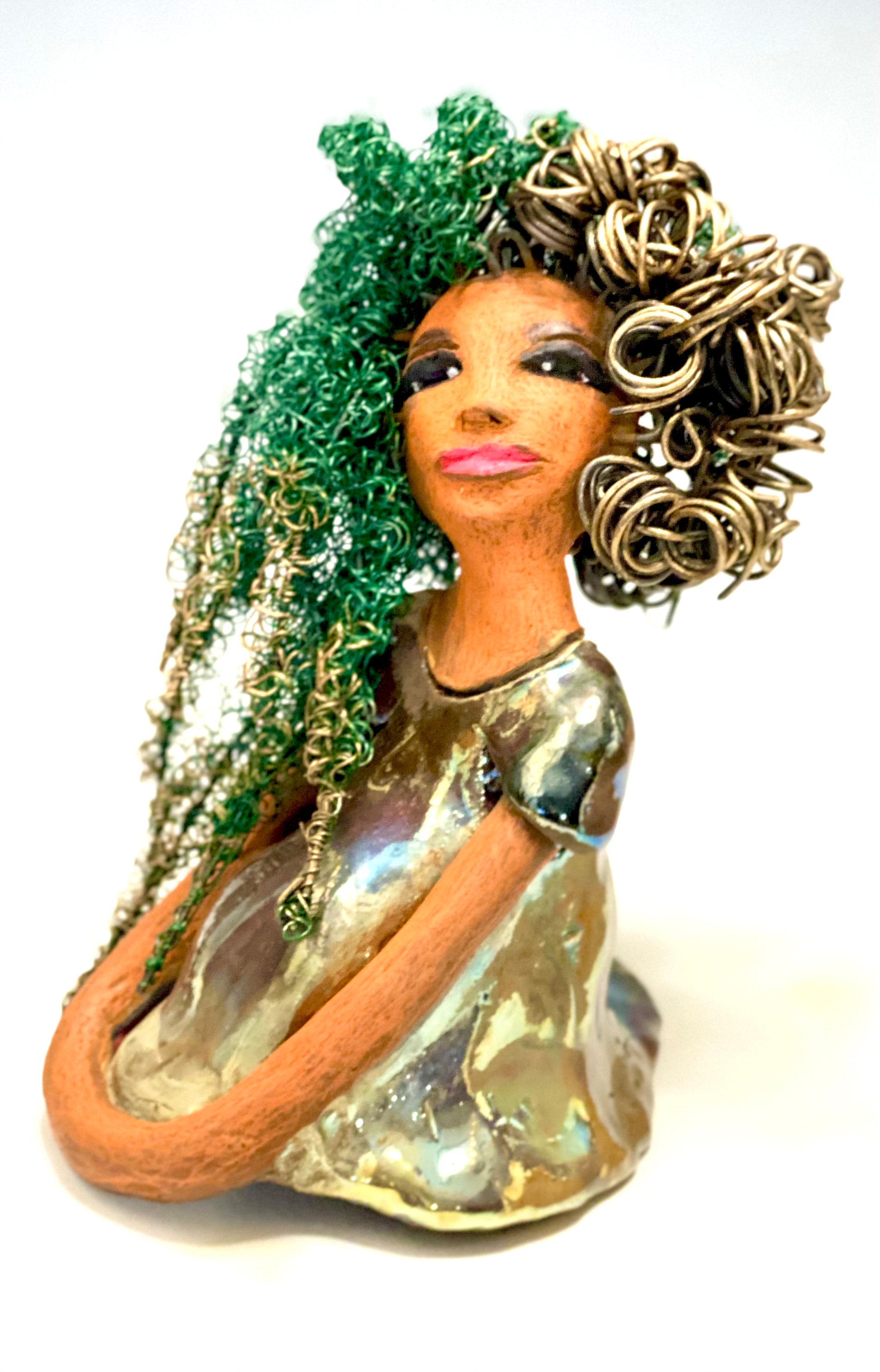 Diane stands 7" x 6" x 5.5" and weighs 1.9 lbs. She has a lovely honey brown complexion with reddish brown lips. She has long twisted wire locs hairstyle waist down!  Diane has a very colorful metallic  copper green antique glazed dress. She has over 75 feet of 16 and 24 gauge  wire for hair. It took over 6 hours just to do her hair! With  eyes wide opened, Diane has hope of finding a new home.