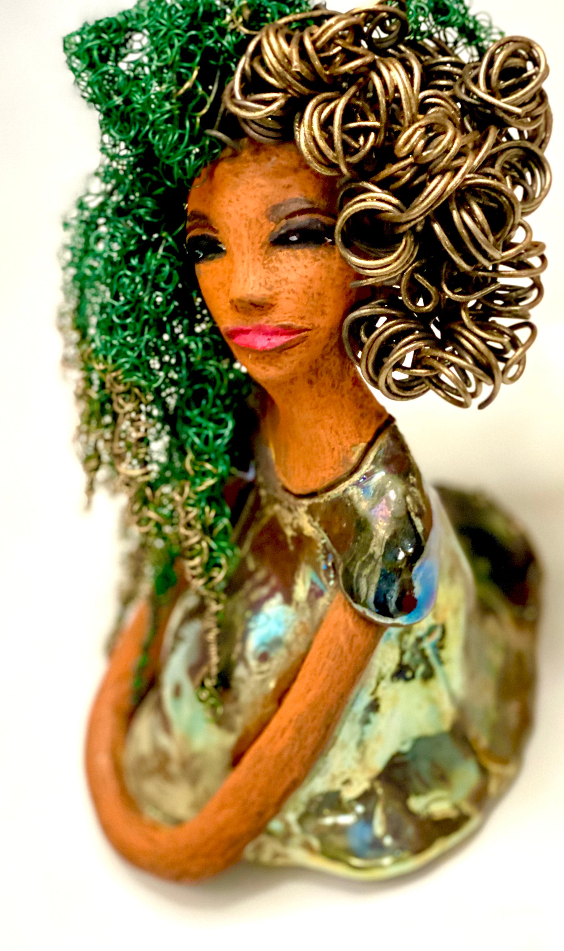 Diane stands 7" x 6" x 5.5" and weighs 1.9 lbs. She has a lovely honey brown complexion with reddish brown lips. She has long twisted wire locs hairstyle waist down!  Diane has a very colorful metallic  copper green antique glazed dress. She has over 75 feet of 16 and 24 gauge  wire for hair. It took over 6 hours just to do her hair! With  eyes wide opened, Diane has hope of finding a new home.