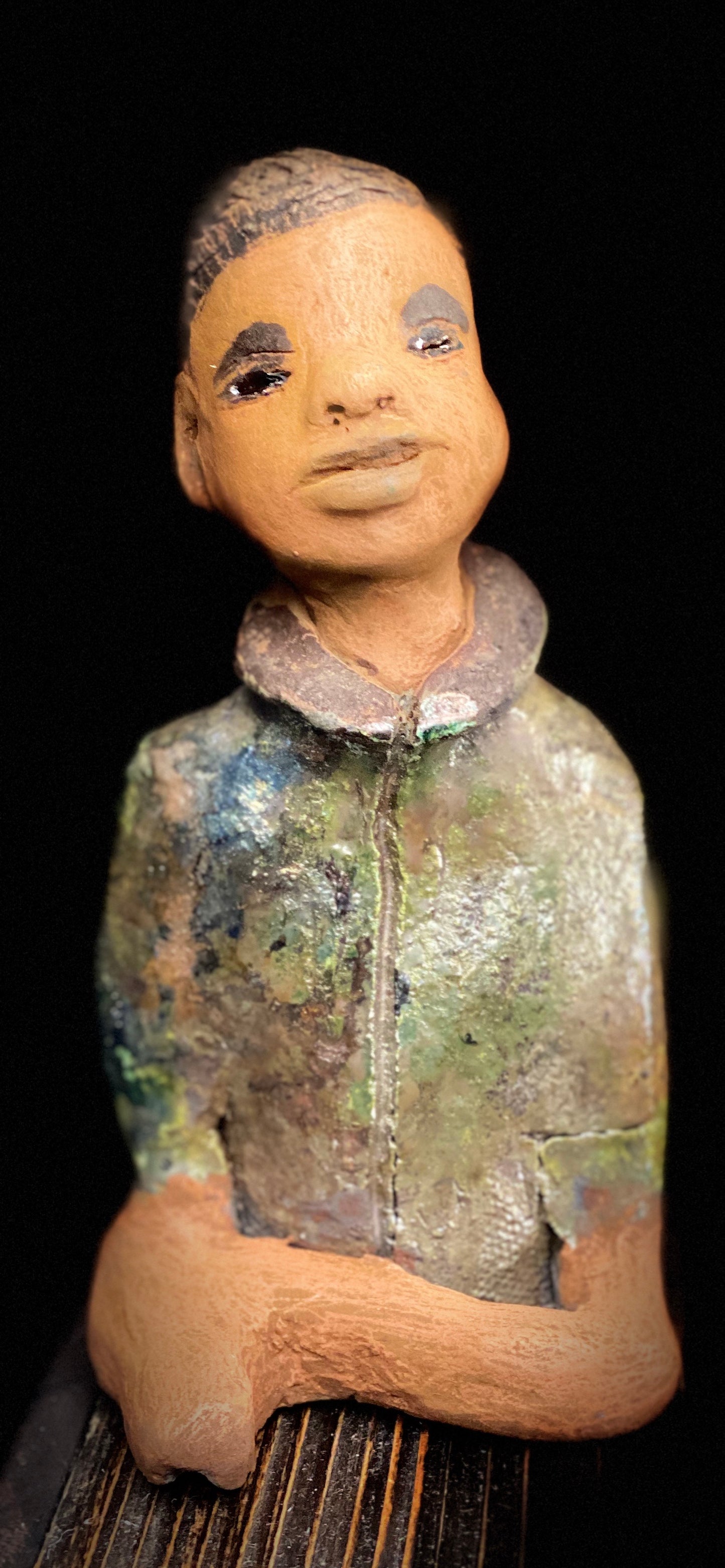 Ray is one confident teen who is ready to make his mark! Ray stands 7"x 3" x 3" and weighs 14 ozs. He has a green metallic jacket with a high collar . Ray complexion is honey brown. His arms are folded as he ponders which college scholarship to accept!!