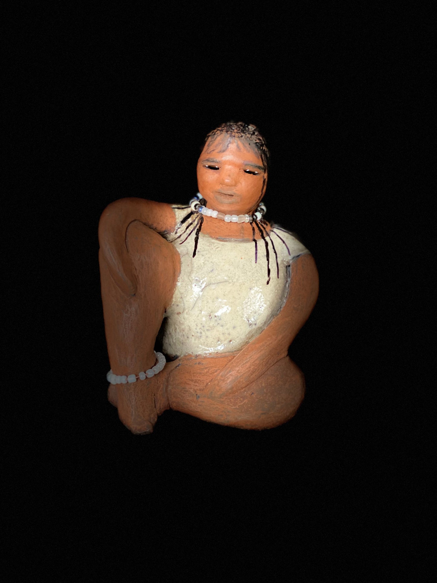 Meet Shelia ! You will fall in love with Shelia! Yes she is a big girl with lots of charm! Her long loving arms are relaxed atop her legs. Shelia has a lovely honey rust colored complexion. Shelia sits 6" x 5" x 4" and weighs 1.5 lbs. Shelia 's dress is a warm matte white crackle. Shelia’s hair is made of clay with many fine draw in braids. Check out our Shipping and Return policy Free Shipping! Got Questions???? Instant Message or Chat with me.