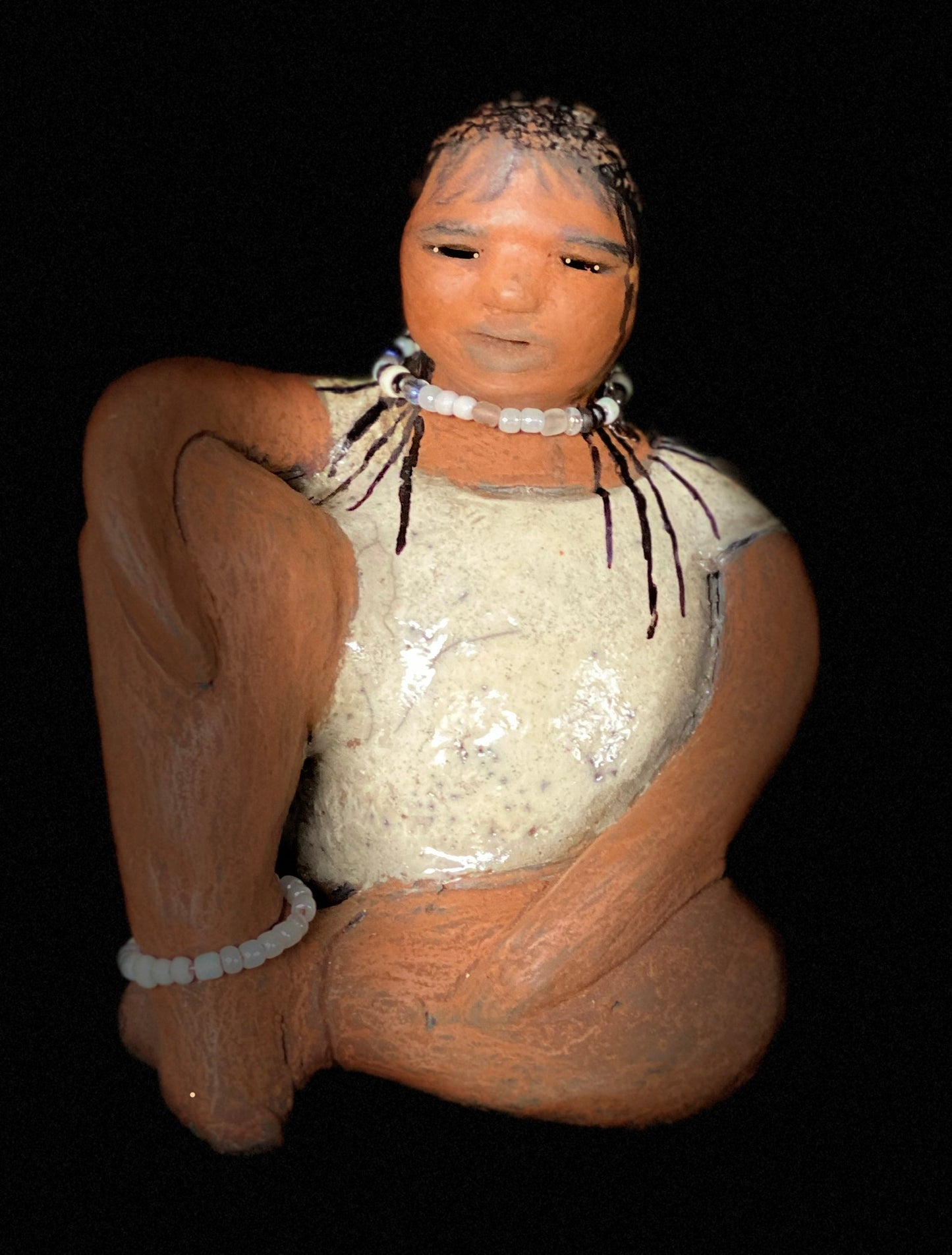 Meet Shelia ! You will fall in love with Shelia! Yes she is a big girl with lots of charm! Her long loving arms are relaxed atop her legs. Shelia has a lovely honey rust colored complexion. Shelia sits 6" x 5" x 4" and weighs 1.5 lbs. Shelia 's dress is a warm matte white crackle. Shelia’s hair is made of clay with many fine draw in braids. Check out our Shipping and Return policy Free Shipping! Got Questions???? Instant Message or Chat with me.