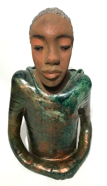 Ivani s the third young man to be introduced in this collection.     Ivan stands 17" x 9" x 10" and weighs 8.12 lbs.     Ivan has an awesome honey brown complexion.     He wears copper green hoodie     Ivan's  hair is made of  clay, black grey, and wavy.  Give Ivan a special place in your home. Free Shipping!