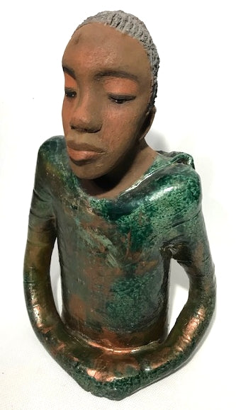 Ivani s the third young man to be introduced in this collection.     Ivan stands 17" x 9" x 10" and weighs 8.12 lbs.     Ivan has an awesome honey brown complexion.     He wears copper green hoodie     Ivan's  hair is made of  clay, black grey, and wavy.  Give Ivan a special place in your home. Free Shipping!