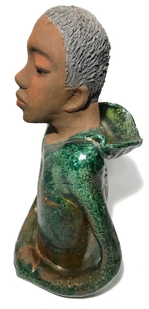 Ivani s the third young man to be introduced in this collection.     Ivan stands 17" x 9" x 10" and weighs 8.12 lbs.     Ivan has an awesome honey brown complexion.     He wears copper green hoodie     Ivan's  hair is made of  clay, black grey, and wavy.  Give Ivan a special place in your home. Free Shipping!