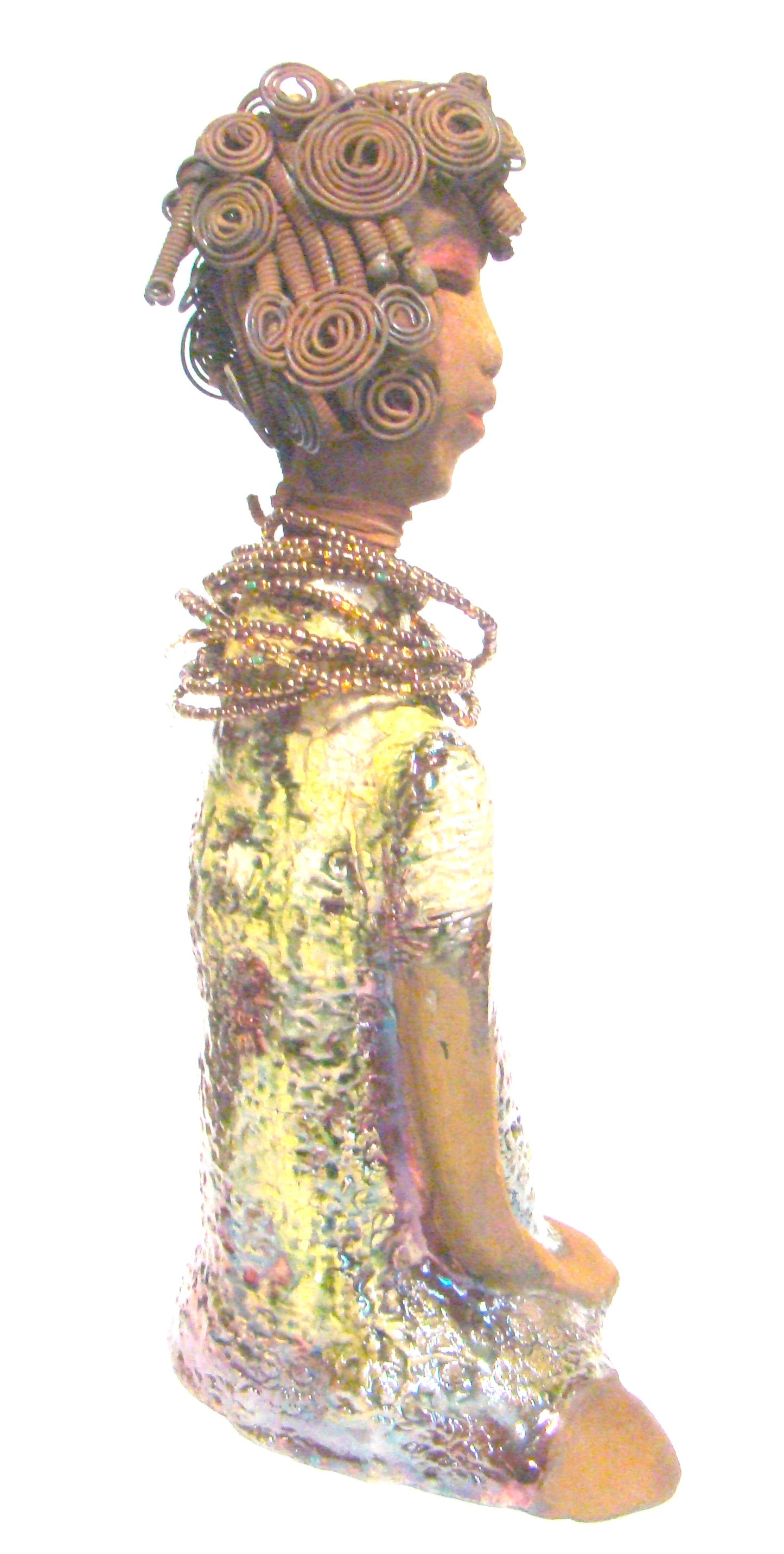 Jade stands 16" x 9" x 6" and weighs 6 lbs. She has a honey brown complexion. Her hair is black and rust brown.