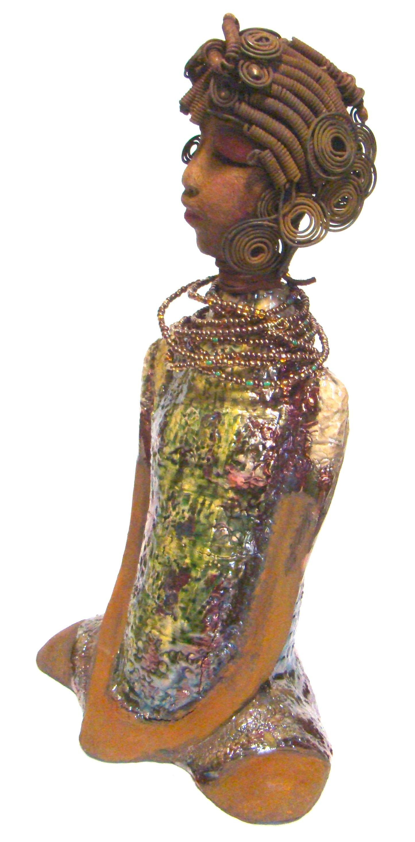 Jade stands 16" x 9" x 6" and weighs 6 lbs. She has a honey brown complexion. Her hair is black and rust brown.