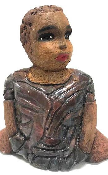Meet Josephine! Josephine stands 6" x 5" x 3"and weighs 15 ozs. Josephine has a lovely honey brown complexion with big bright eyes. She wears a low cut hairdo - Herdew. Her dress is patterned with a metallic copper glaze. Josephine has her long loving arms at her side. Josephine will make a great gift or a starter piece From the Herdew Collection!
