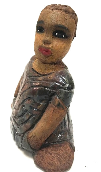 Meet Josephine! Josephine stands 6" x 5" x 3"and weighs 15 ozs. Josephine has a lovely honey brown complexion with big bright eyes. She wears a low cut  hairdo  - Herdew. Her dress is patterned with a metallic copper glaze. Josephine has her long loving arms at her side. Josephine will make a great gift or a starter piece From the Herdew Collection!
