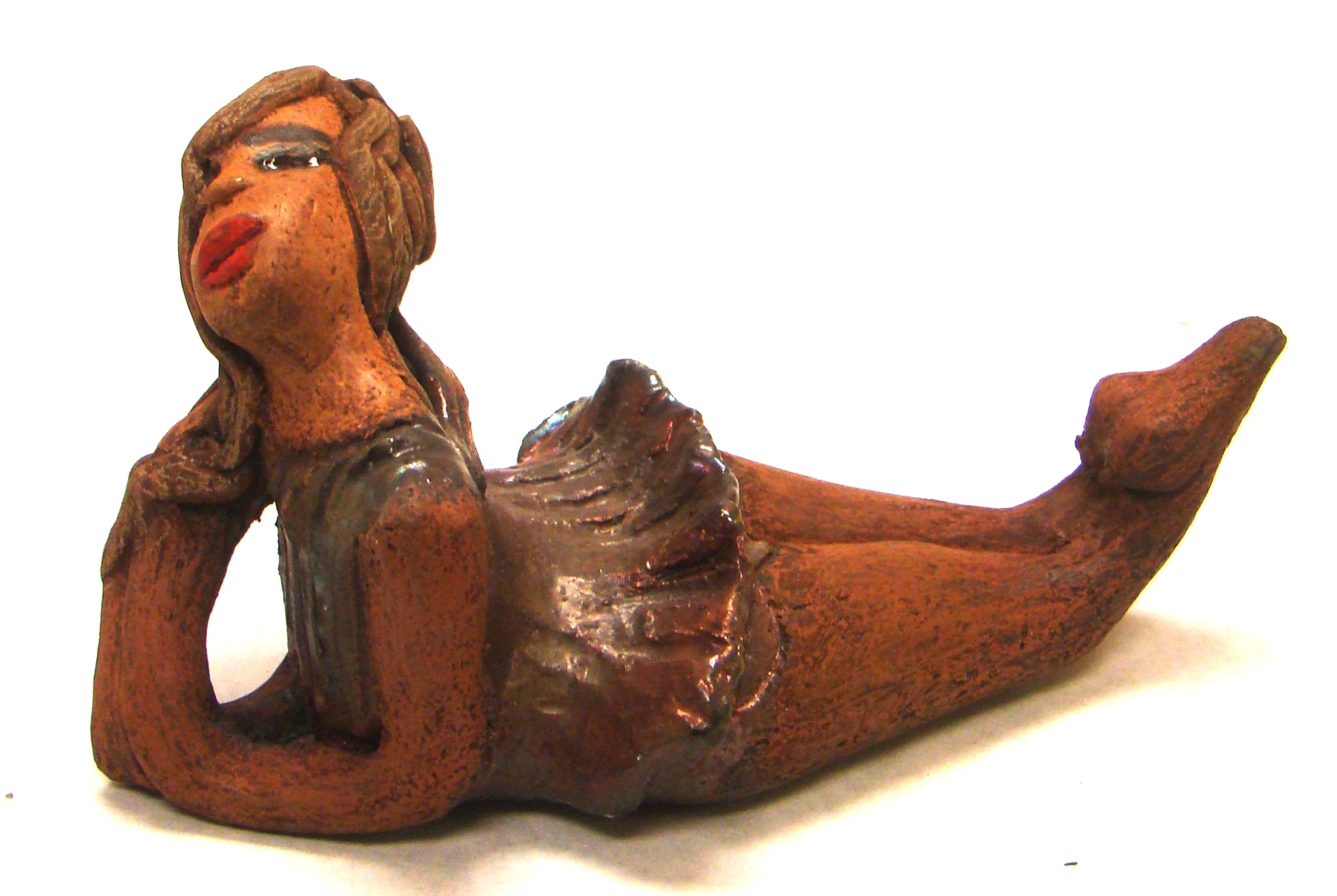Juanita  stands 4" x 3" x 7" and weighs 1 lb.     She has a lovely honey brown complexion.     Juanita has a copper iridescent  dress.     Her long loving arms rest underneath her face as she  caresses her brown clay hair.     Juanita will definitely get your guest attention and create conversation.