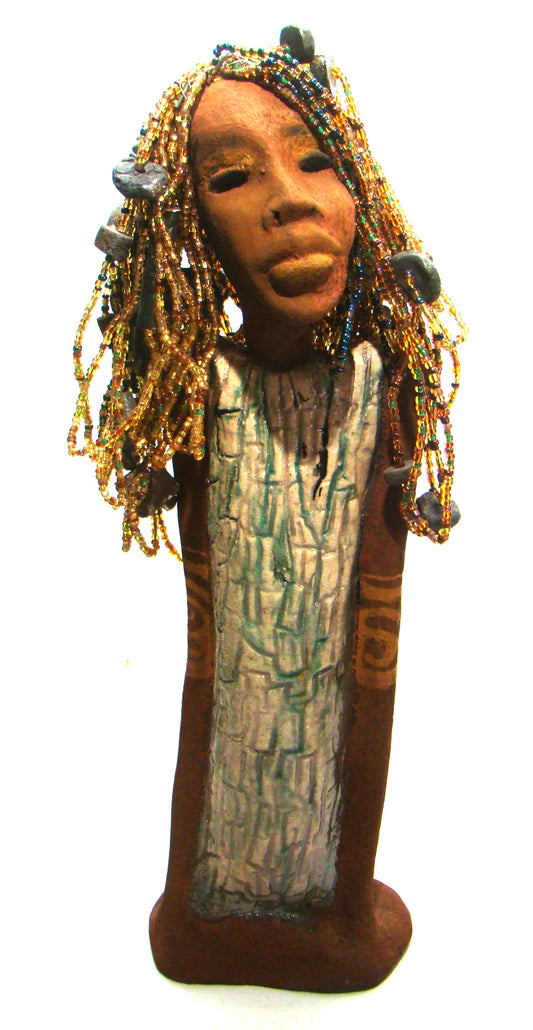 Kim's beaded hair took over 12 hours to complete! She stands 20" x 6" x 4". Kim has honey brown rust complexion, green eye shadow, and ruby red lips.