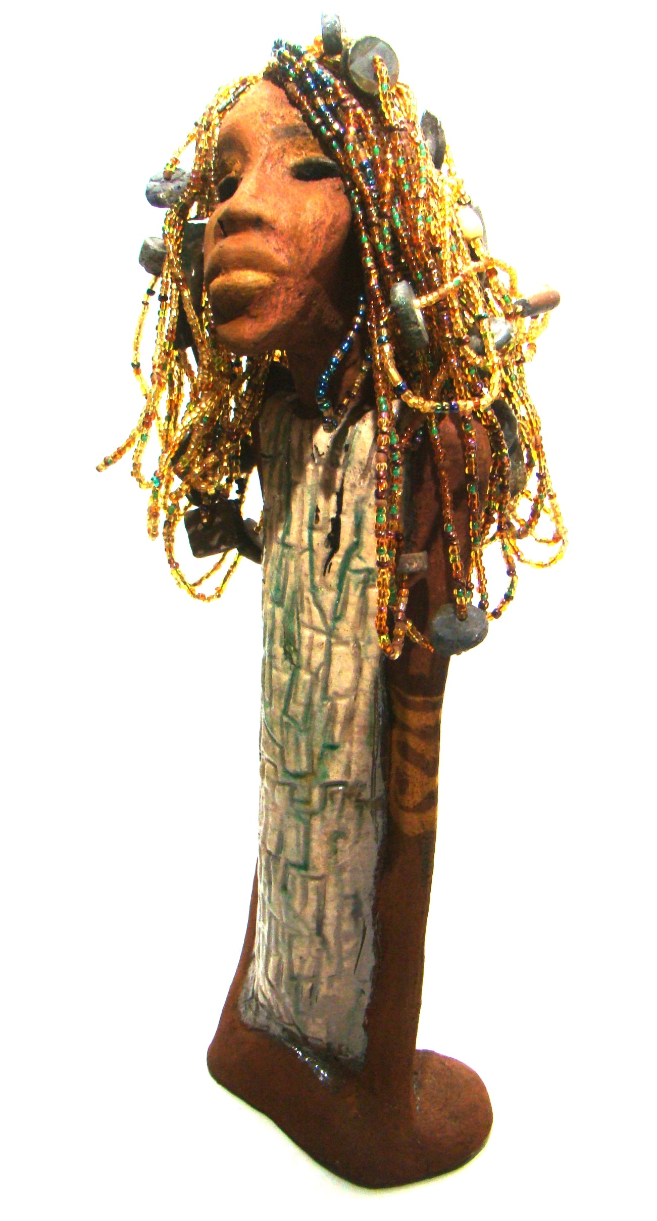 Kim's beaded hair took over 12 hours to complete! She stands 20" x 6" x 4". Kim has honey brown rust complexion, green eye shadow, and ruby red lips.