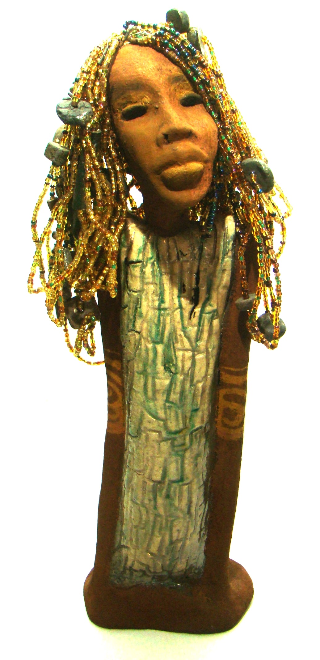 Kim's beaded hair took over 12 hours to complete! She stands 20" x 6" x 4". Kim has honey brown rust complexion, green eye shadow, and ruby red lips.