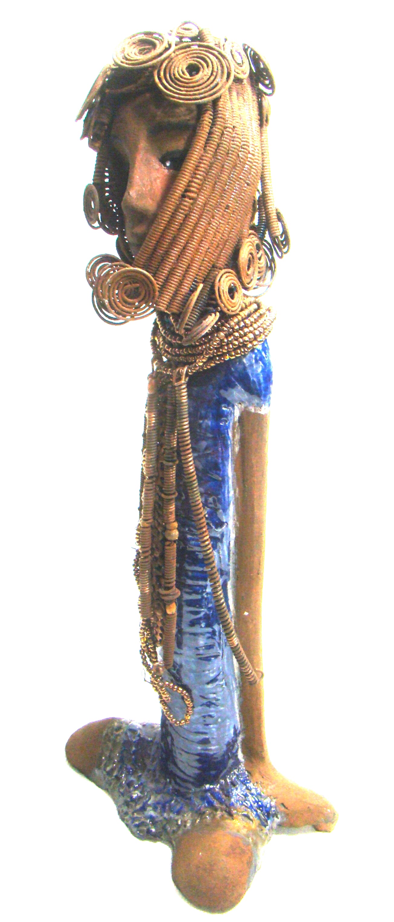 Kya stands 20" x 8" x 5" and weighs 6.04 lbs.     She has a lovely honey brown complexion.     Kya has over 40 feet of rust wire coils and spiral hair.     Her dress is a metallic blue with streaks of copper.     Her necklace is made from rust wire coils and amber beads.     Kya has long loving arms that are placed behind her.     Kya radiates like a blue diamond in the sky.     Give Kya a special place in your home!     Free Shipping!