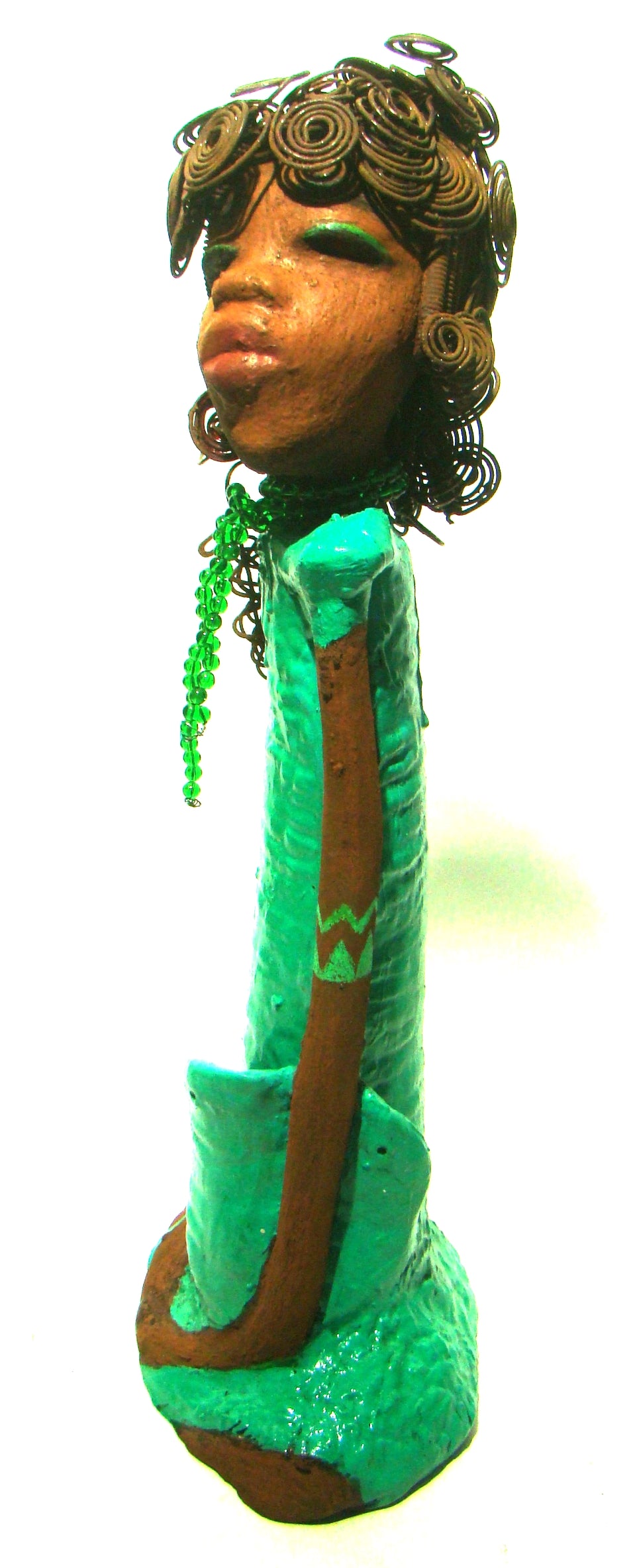 Melissa stands 18" x 9" x  5" and weighs 6.6 lbs.     She has over 30 feet of wire curls, twist, and coiled hair.     Melissa has a lovely honey brown complexion.     She has a aqua blue green dress with matching open purse.     Melissa is a tall statuesque goddess that awaits a new home.     Free Shipping!