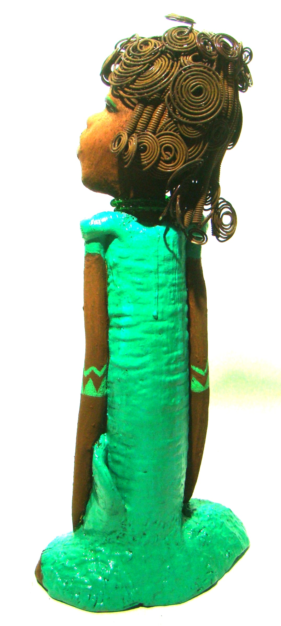 Melissa stands 18" x 9" x  5" and weighs 6.6 lbs.     She has over 30 feet of wire curls, twist, and coiled hair.     Melissa has a lovely honey brown complexion.     She has a aqua blue green dress with matching open purse.     Melissa is a tall statuesque goddess that awaits a new home.     Free Shipping!