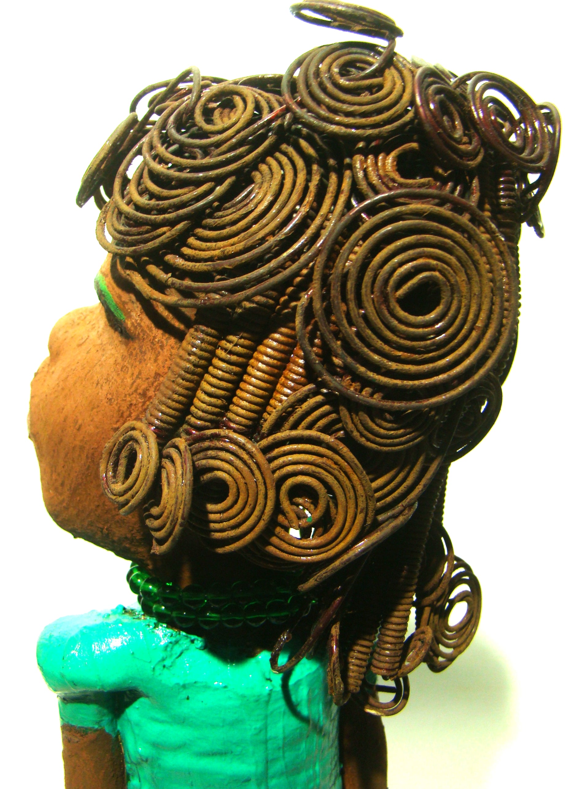 Melissa stands 18" x 9" x  5" and weighs 6.6 lbs.     She has over 30 feet of wire curls, twist, and coiled hair.     Melissa has a lovely honey brown complexion.     She has a aqua blue green dress with matching open purse.     Melissa is a tall statuesque goddess that awaits a new home.     Free Shipping!