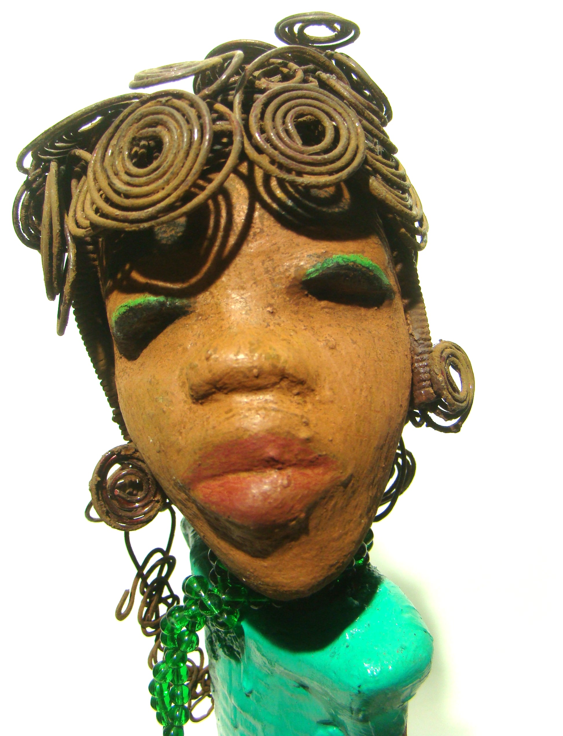 Melissa stands 18" x 9" x  5" and weighs 6.6 lbs.     She has over 30 feet of wire curls, twist, and coiled hair.     Melissa has a lovely honey brown complexion.     She has a aqua blue green dress with matching open purse.     Melissa is a tall statuesque goddess that awaits a new home.     Free Shipping!