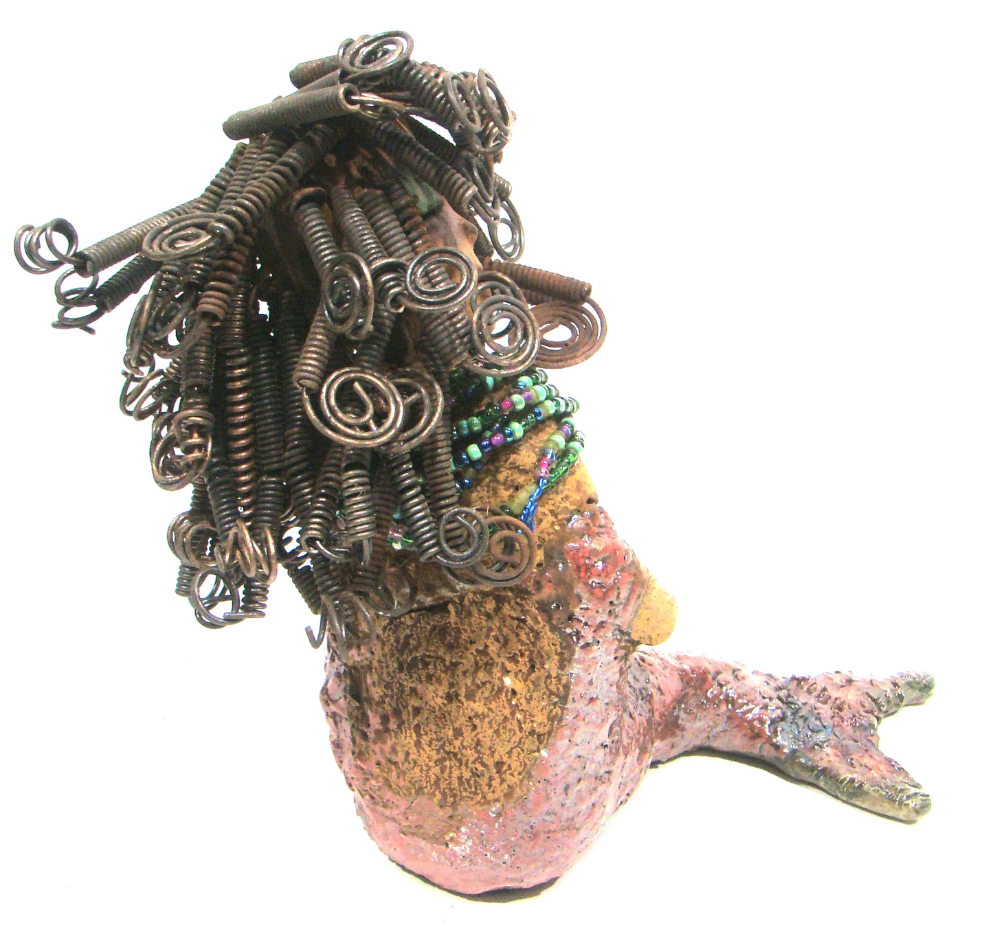 Meranda sits 9" x 10" x 4" and weighs 3.5 lbs. She has over40 feet of 16 gauge wire hair. Meranda complexion is two tone cocoa brown. Her scales are a textured metallic alligator green and copper.
