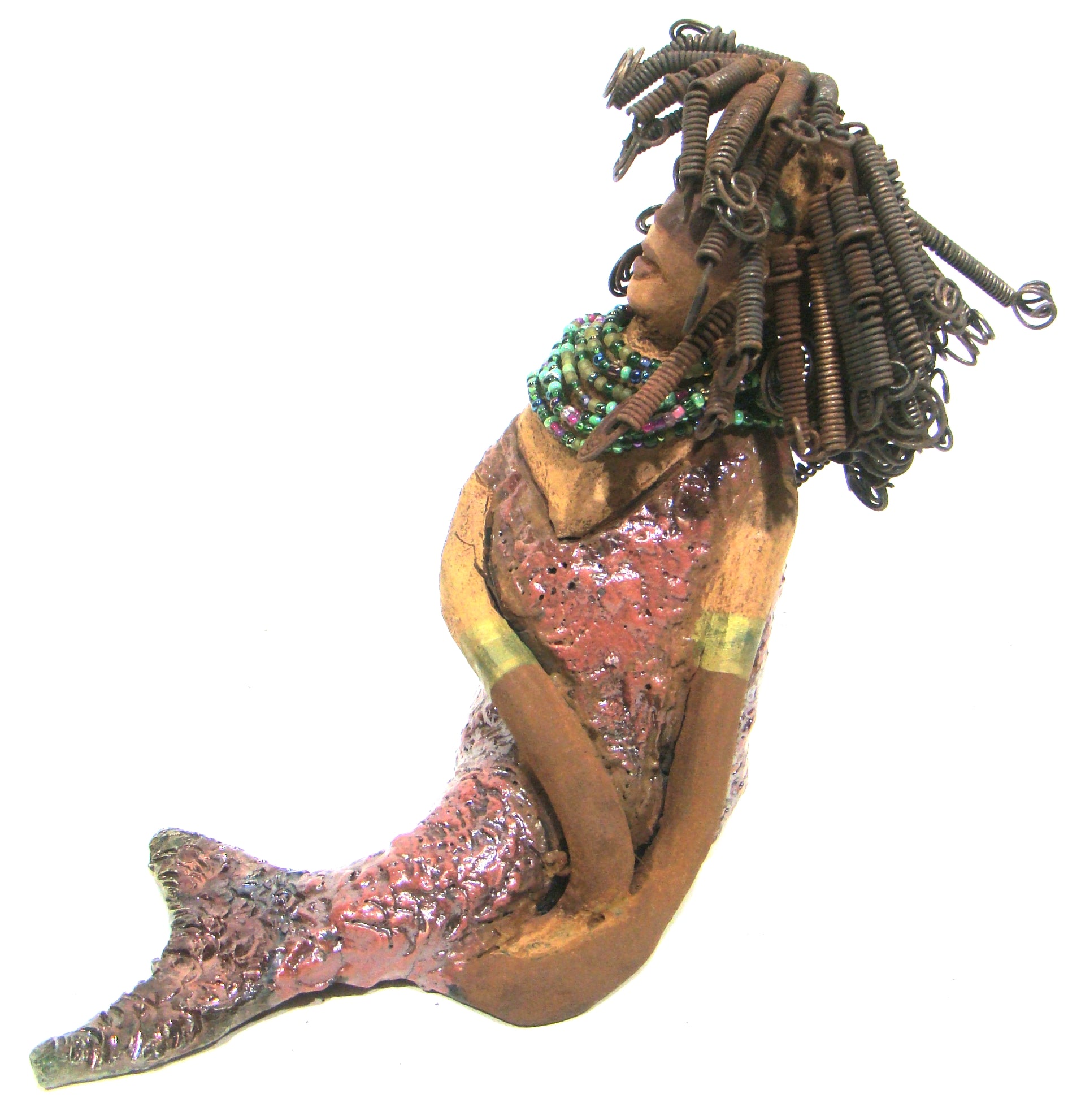 Meranda sits 9" x 10" x 4" and weighs 3.5 lbs. She has over40 feet of 16 gauge wire hair. Meranda complexion is two tone cocoa brown. Her scales  are a  textured metallic alligator green and copper.