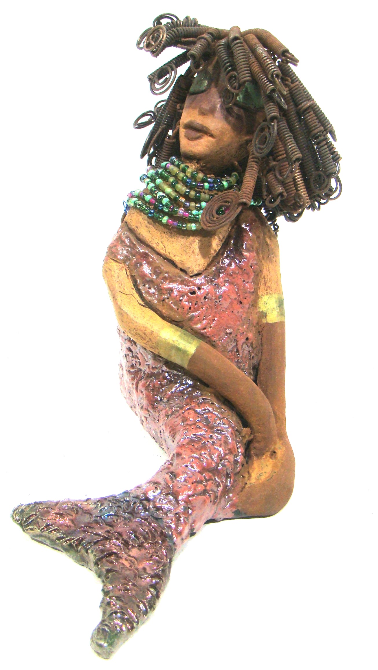 Meranda sits 9" x 10" x 4" and weighs 3.5 lbs. She has over40 feet of 16 gauge wire hair. Meranda complexion is two tone cocoa brown. Her scales  are a  textured metallic alligator green and copper.
