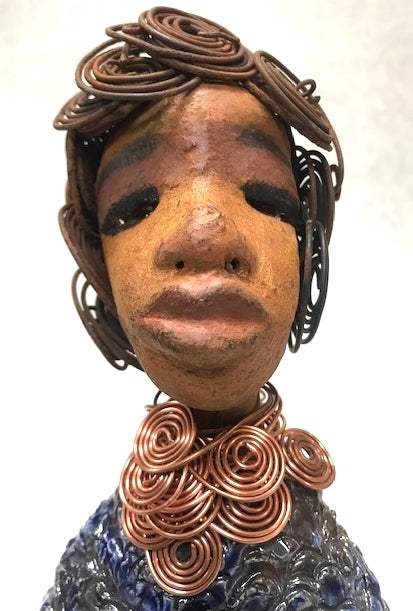 Shelia stands 12" x 10" x 4" and weighs 3.13 lbs. Shelia has a two tone honey brown complexion. She has over 15 feet of spiral wire hair which took over two hours to style. Shelia wears a textured sky blue swimsuit Her layered spiral copper necklace hangs above her long loving arm. Shelia is such a ladylike Mermaid. She sits tall and proud. Compare her to Harmony the mermaid. Give Shelia or Harmony a special place to sit in your home!