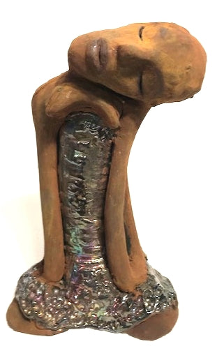 Meet Peace!      Peace stands 9" x 5" x 4"and weighs 2.01 lbs.     She has a lovely honey brown complexion and bald.     Peace has her tilted and resting on her shoulder.     Her long loving arms are nested underneath her chin.     Peace has a glossy textured metallic dress.     Peace is at peace and all is well.  Let Peace bring tranquility to your home!