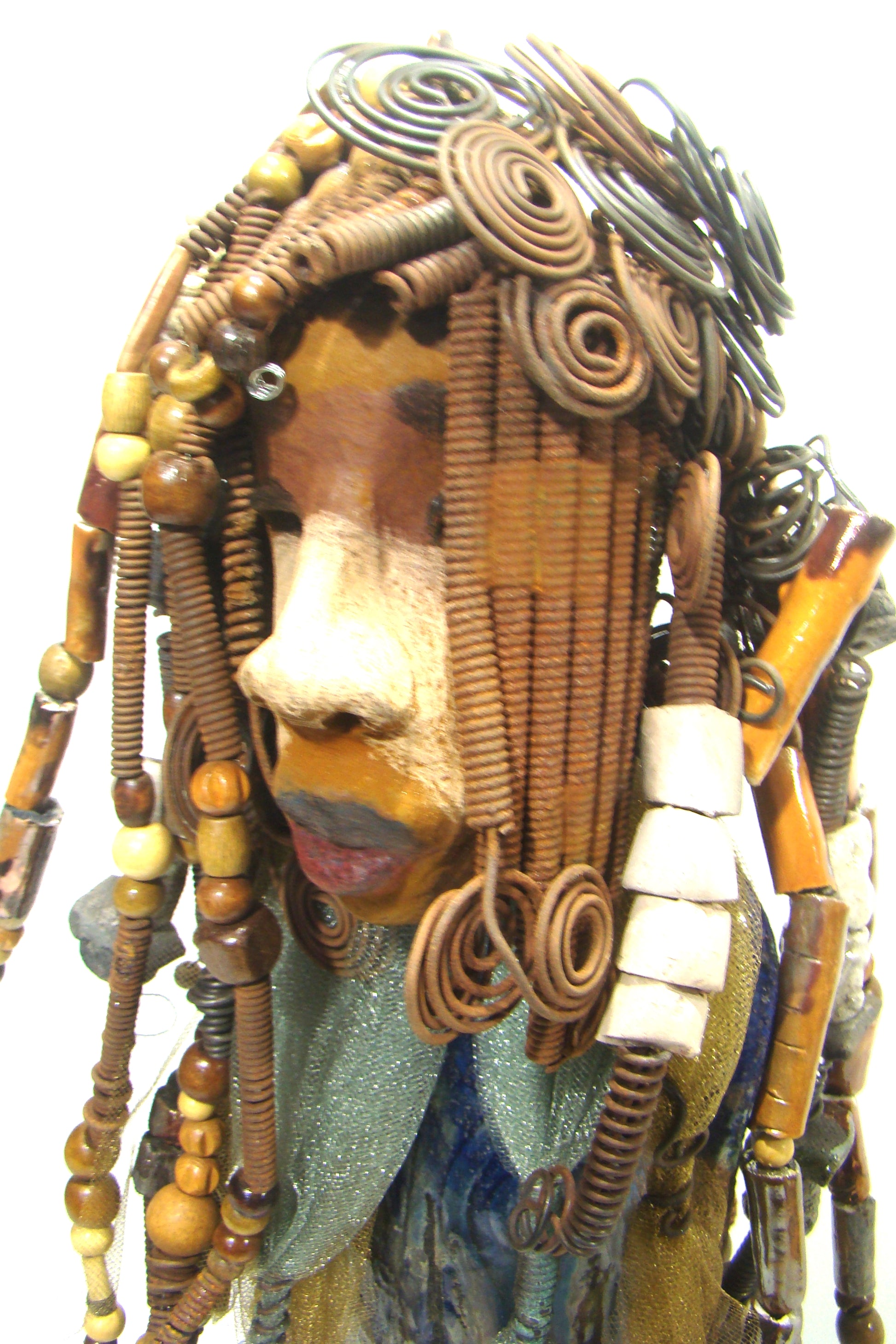 Sabrina stands 23" x 8" x 5" and weighs 9.2 lbs. She as an awesome two tone honey brown complexion. Sabrina's dress is a dark metallic blue with streaks of copper. A blue and gold tulle drapes around her neck Sabrina has long loving arms found typically on Herdew's sculptures. Sabrina sits with anticipation of being a show piece in your home especially now with her New Makeover!