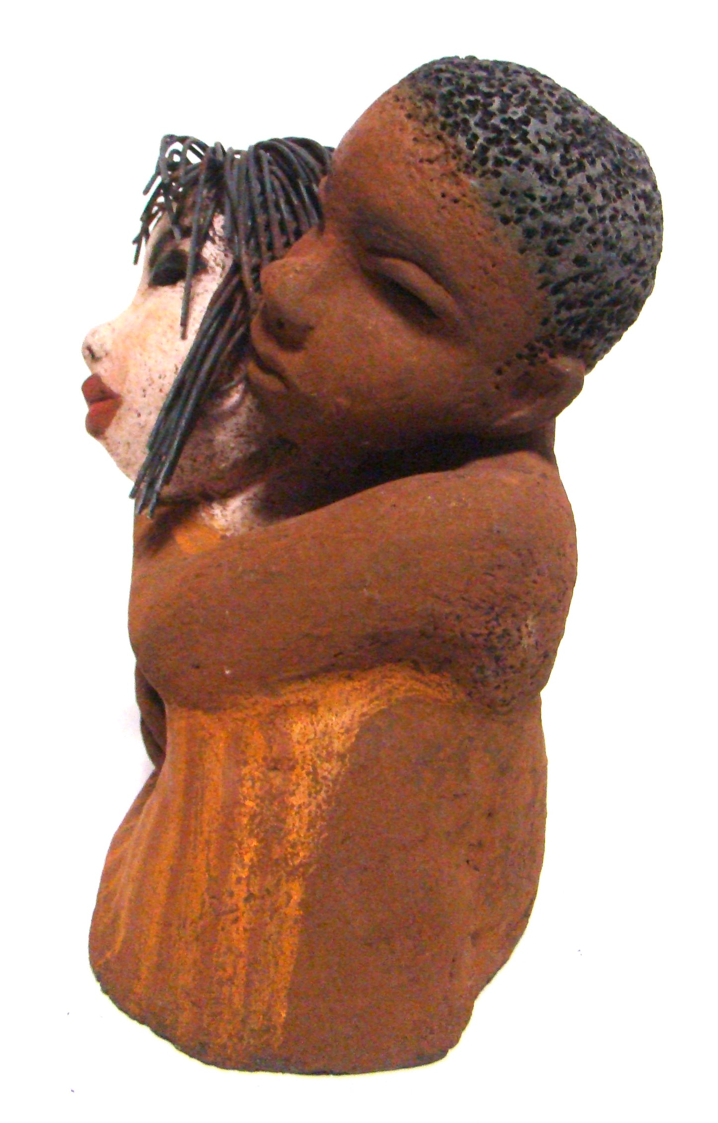 Loving You stands 9" x 9" x 5" and weighs 5.02 lbs. He has a honey brown complexion, she is high beige brown. She has vertical yellow brown on her dress. His arms are totally wrapped around her.