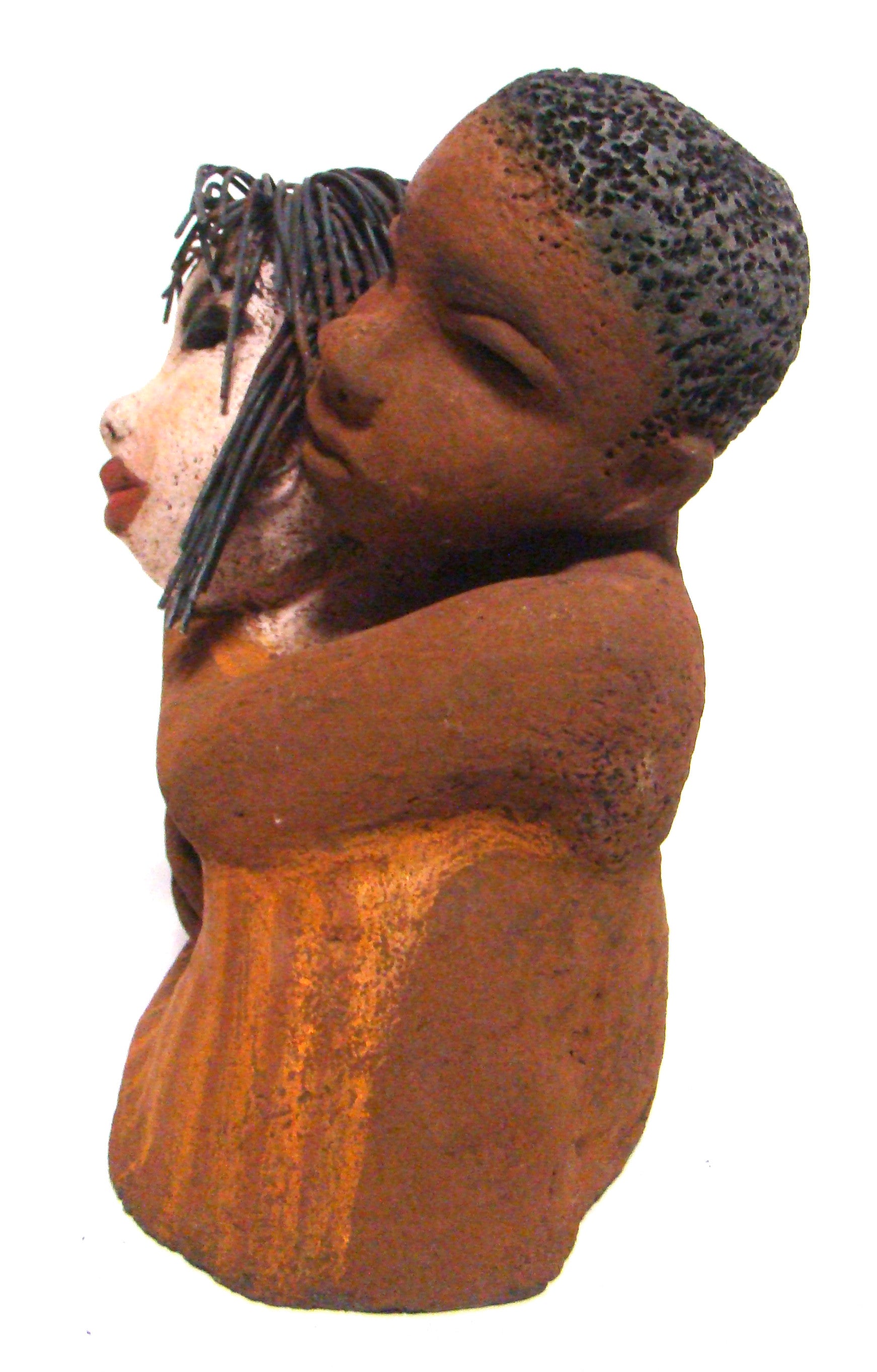 Loving You stands 9" x 9" x 5" and weighs 5.02 lbs. He has a honey brown complexion, she is high beige brown. She has vertical yellow brown on her dress. His arms are totally wrapped around her.