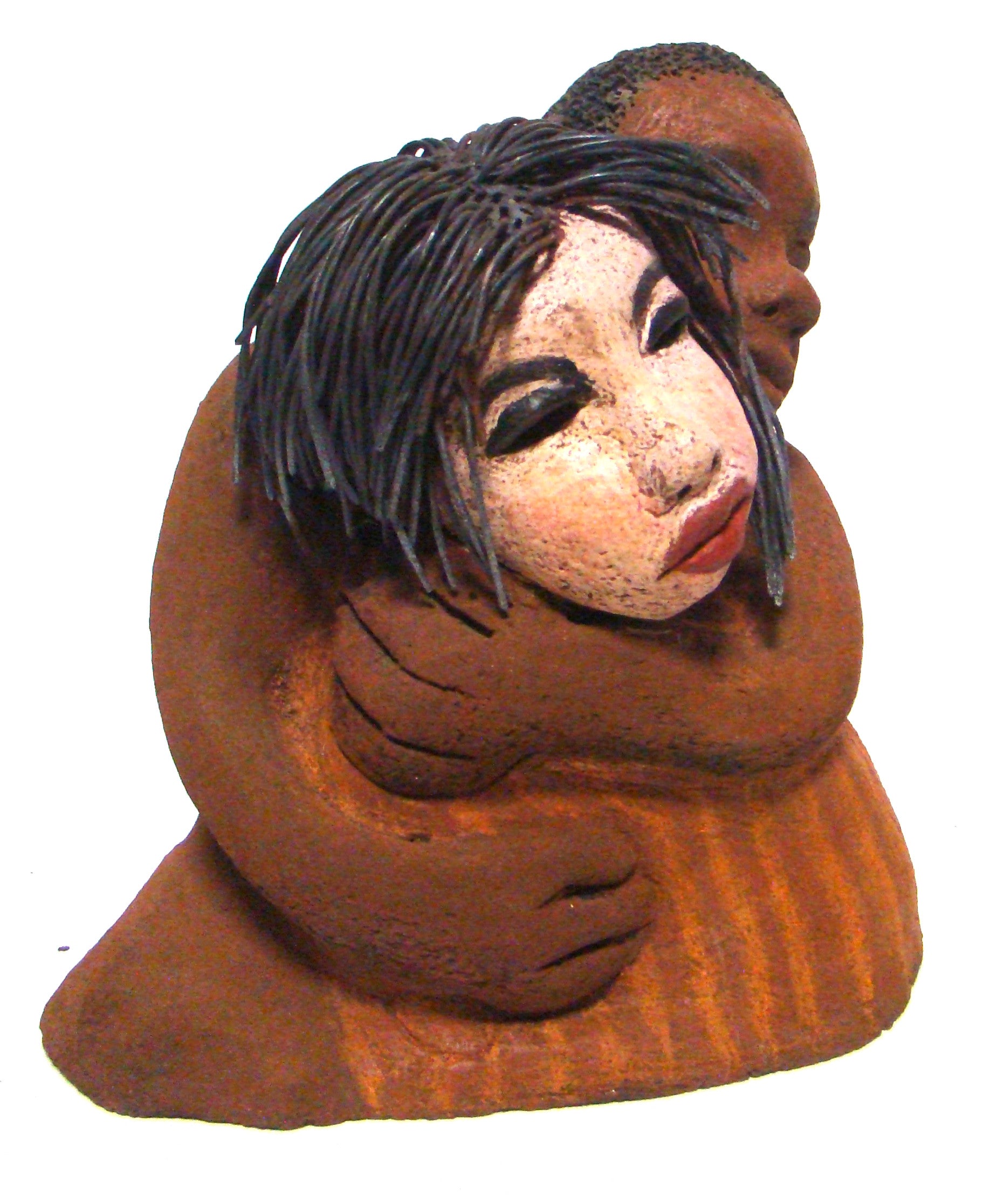 Loving You stands 9" x 9" x 5" and weighs 5.02 lbs. He has a honey brown complexion, she is high beige brown. She has vertical yellow brown on her dress. His arms are totally wrapped around her.